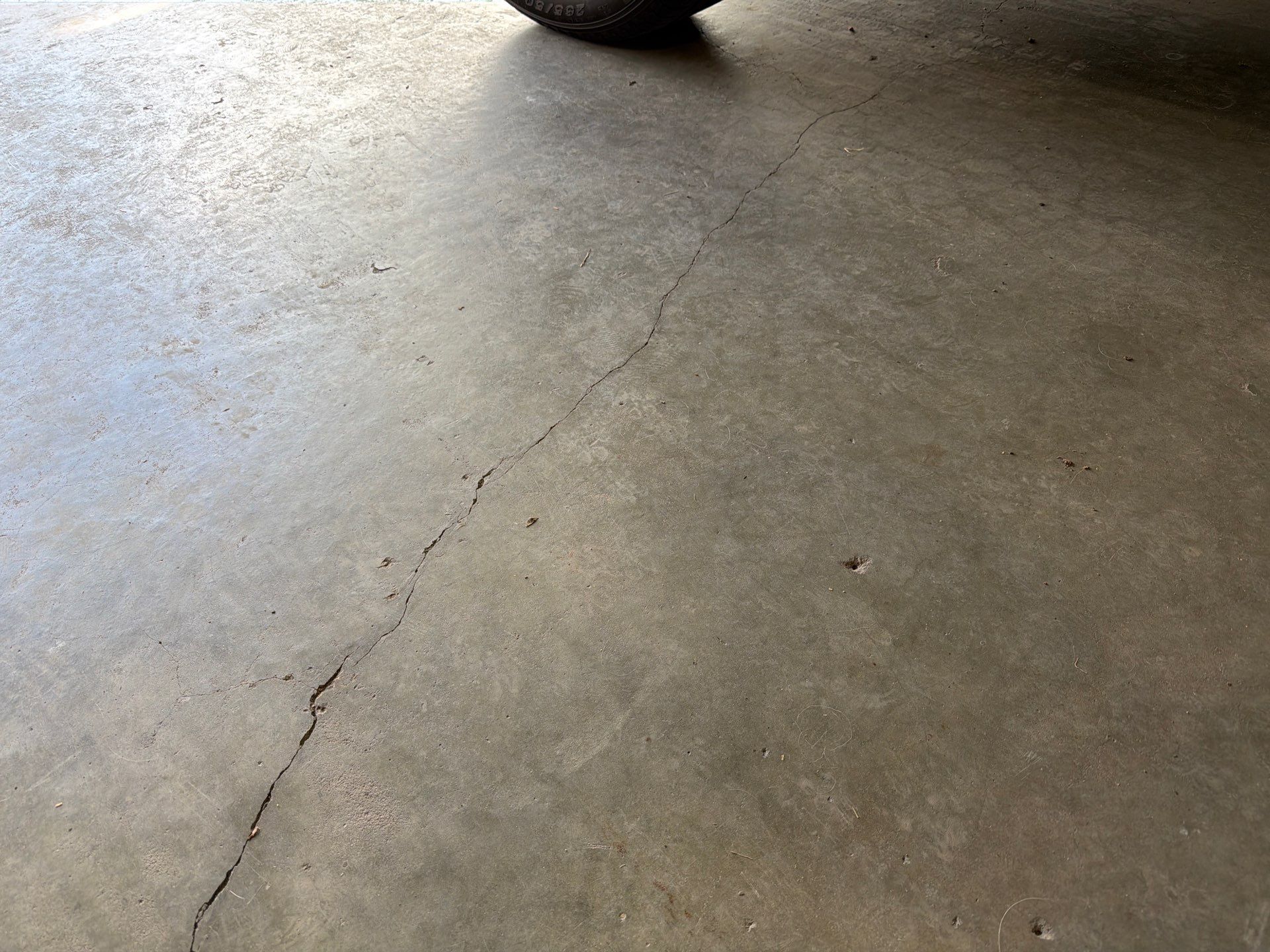 Residential Garage Floor Coating with Feather Grey Finish in Sioux Falls by Select Painting, Coatings & Garage Cabinets