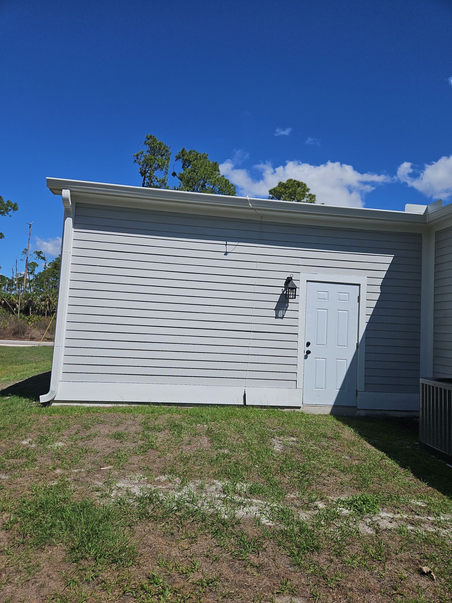 Downspout Installation using 3X4 Elbow Downspout in Port Charlotte FL by Gutter Professors