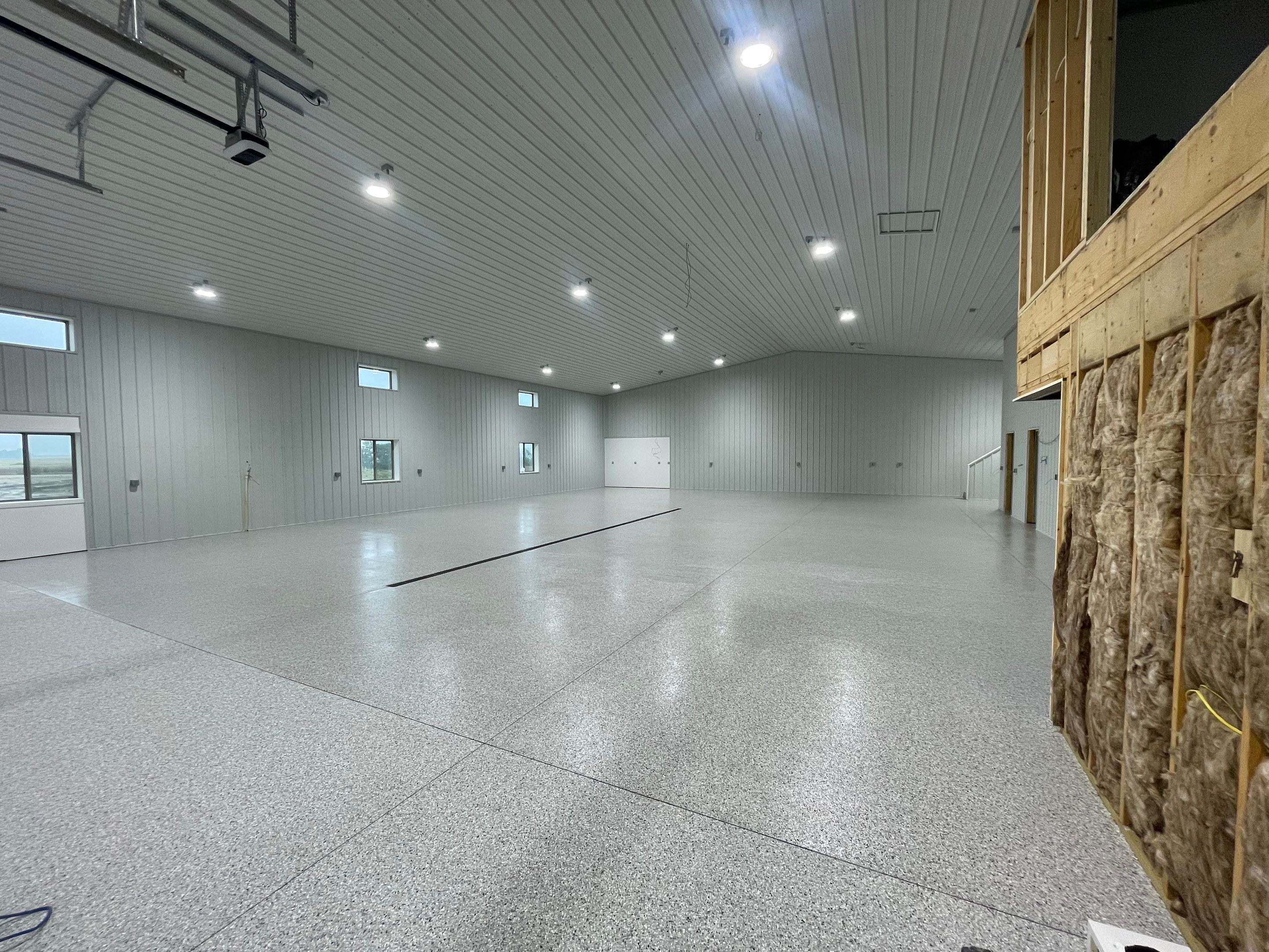 Custom Speckled Floor Coating for Large Montrose Shop by Select Painting, Coatings & Garage Cabinets