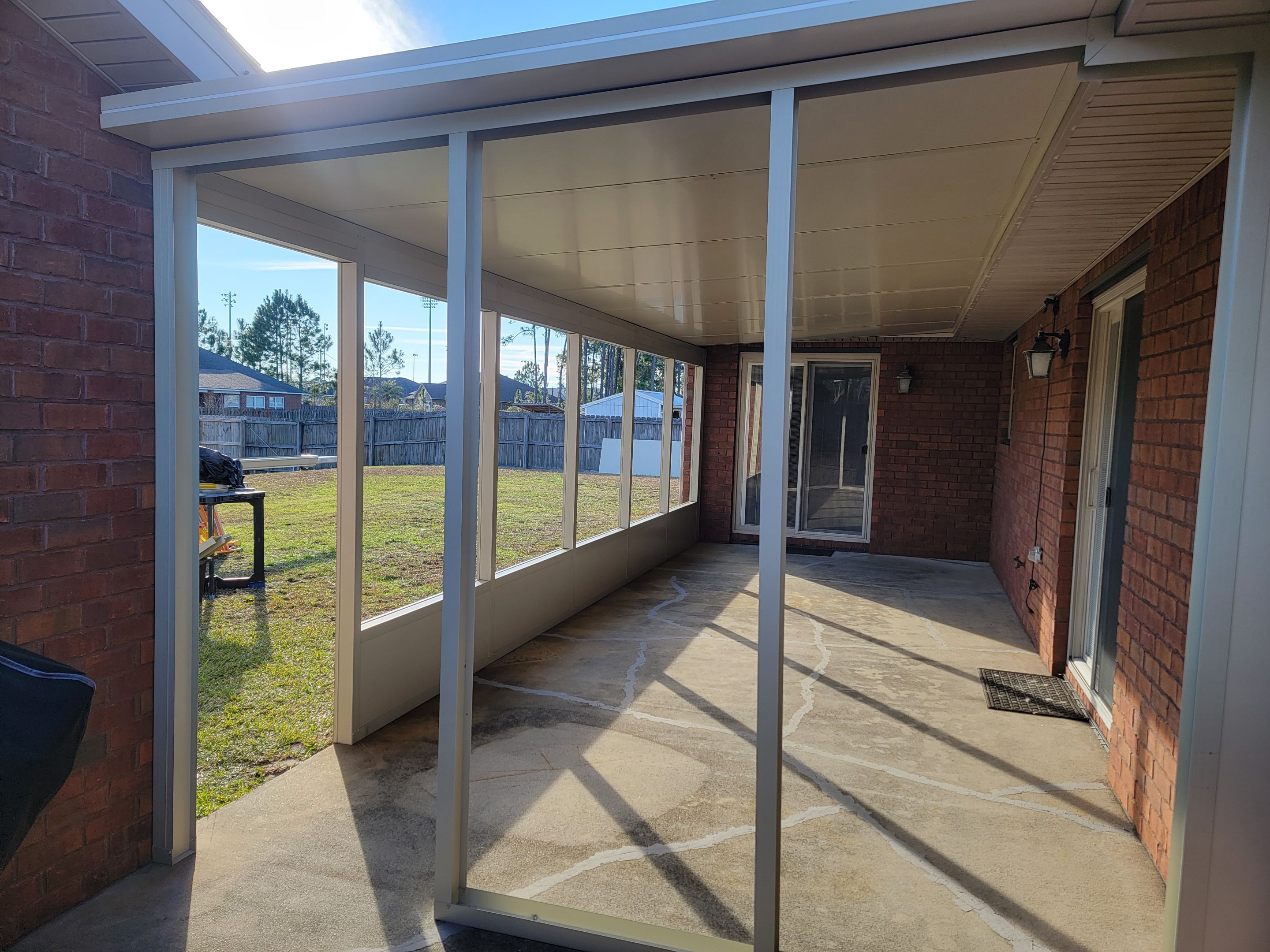 Enclosure w/Vinyl Windows using Colorbeam by Titan Sunrooms