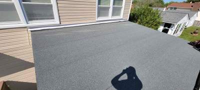 Roof Installation using Asphalt Flat Roofing