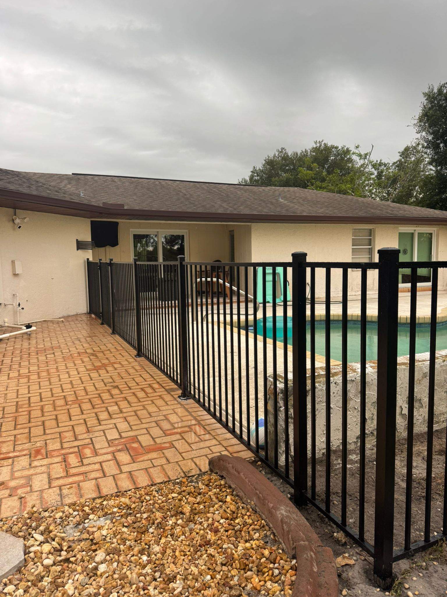 Black Aluminum Pool Safety Fence Installation in Punta Gorda by True Fence LLC