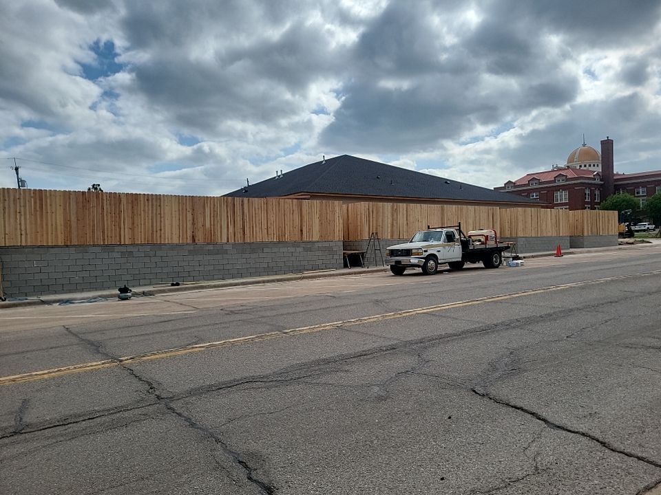 Cedar Fence using Cedar Pickets and Metal Poles by Clays Services Inc