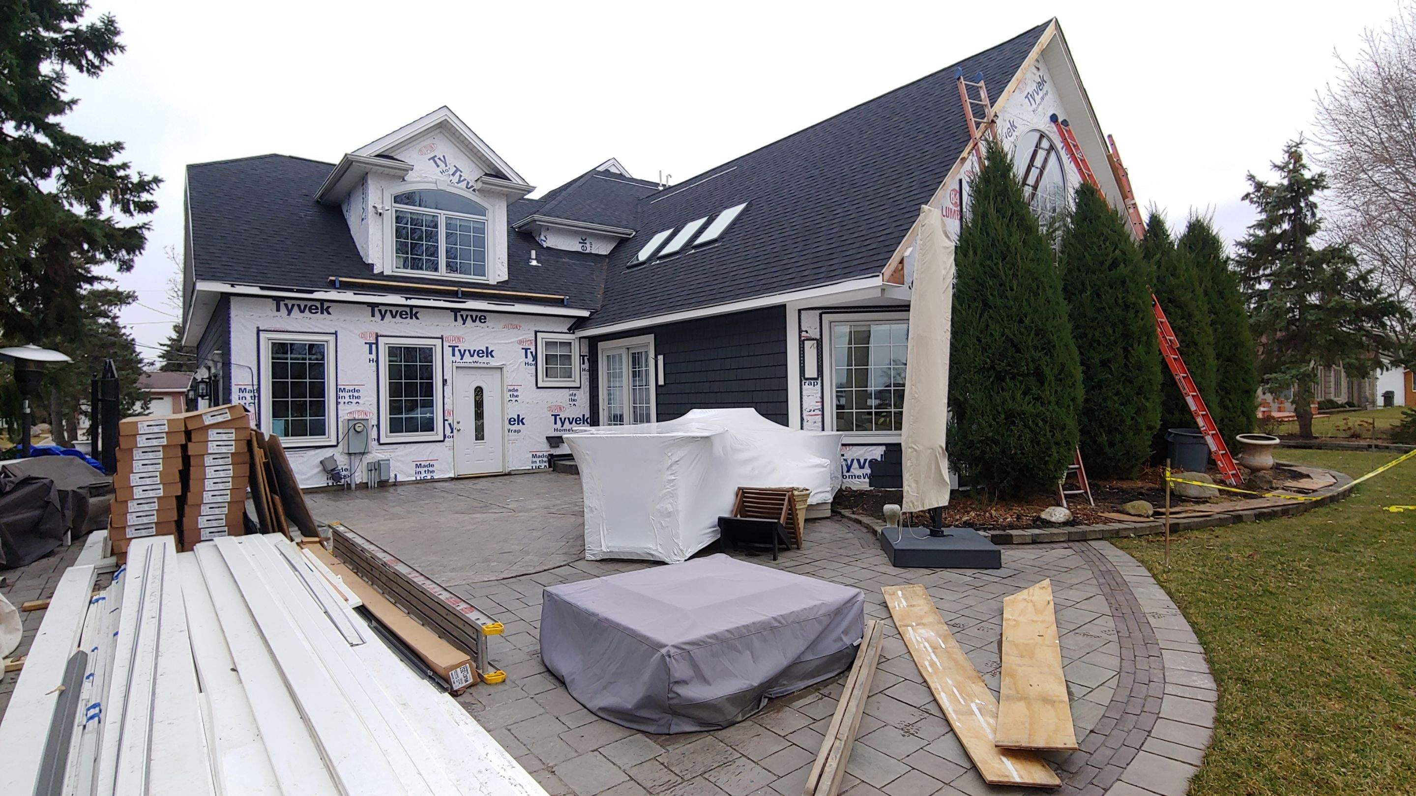 Exterior Renovations- Siding, Concrete, Railings, and Entry Door  by Ivy Lea Construction