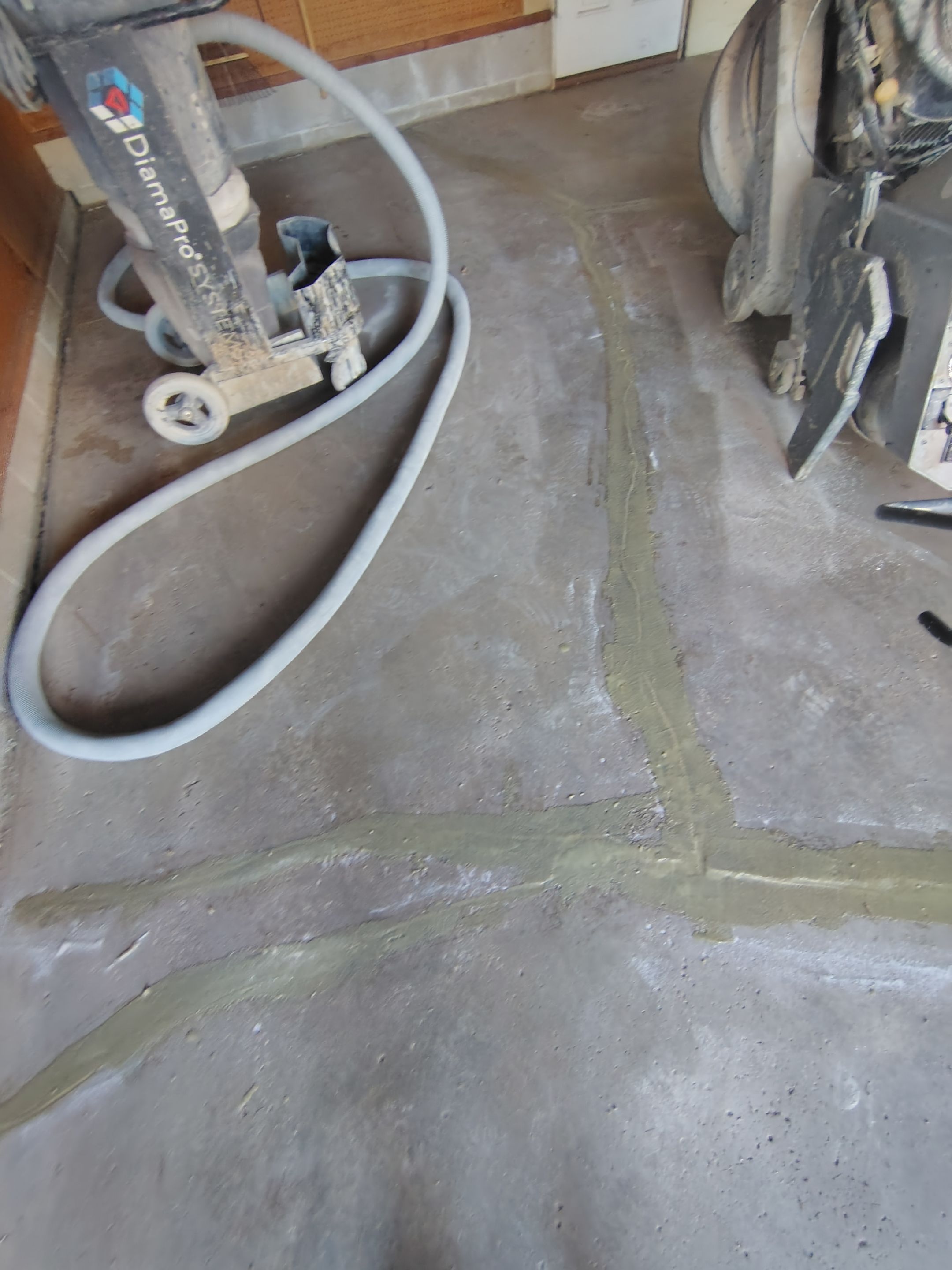 Sioux Falls Garage Epoxy Floor Installation and Concrete Crack Repair by Select Painting, Coatings & Garage Cabinets