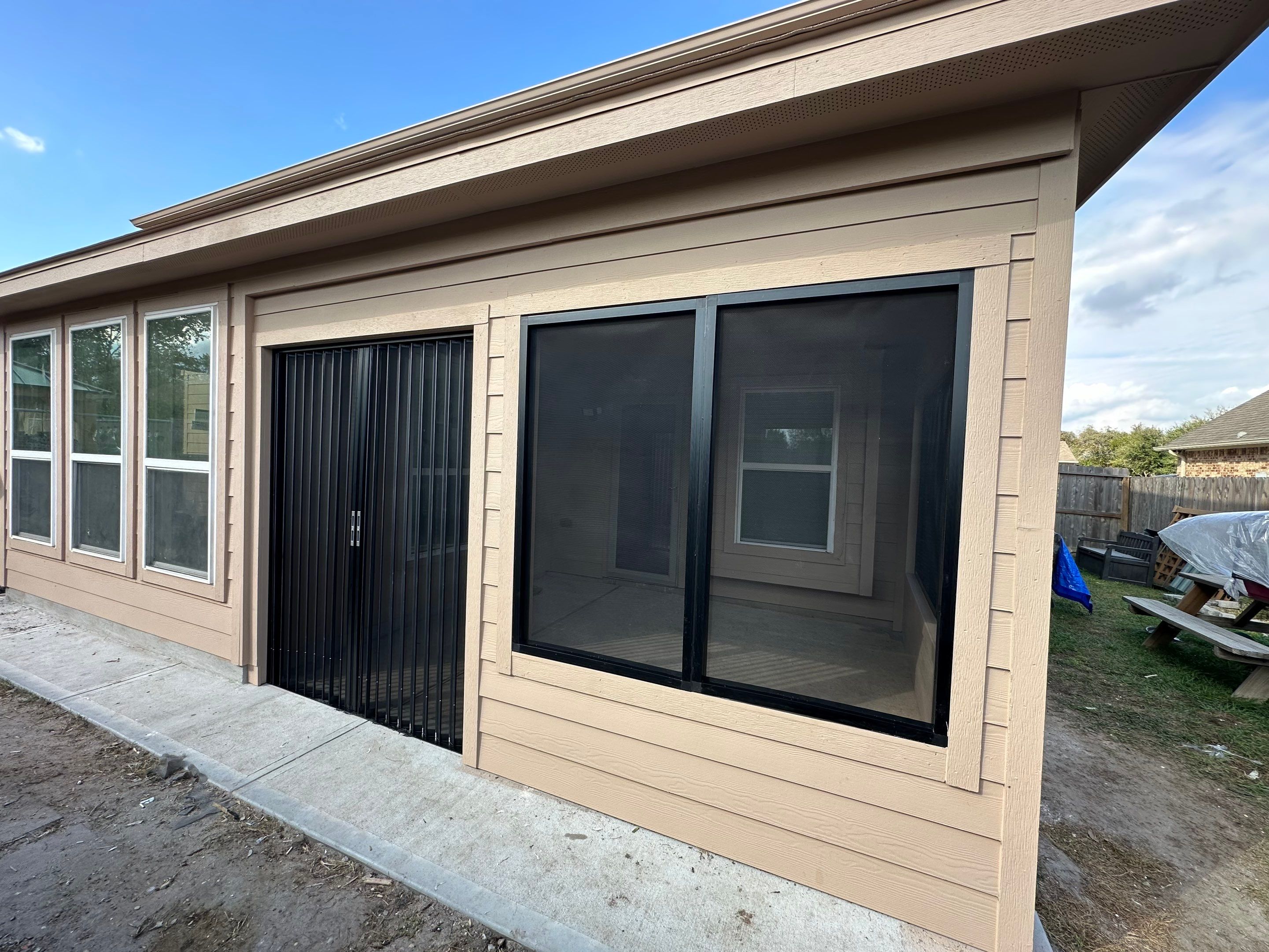 Project Case Review: Sunroom Addition, Patio Integration & Drainage Upgrade by Texas Urban Elements