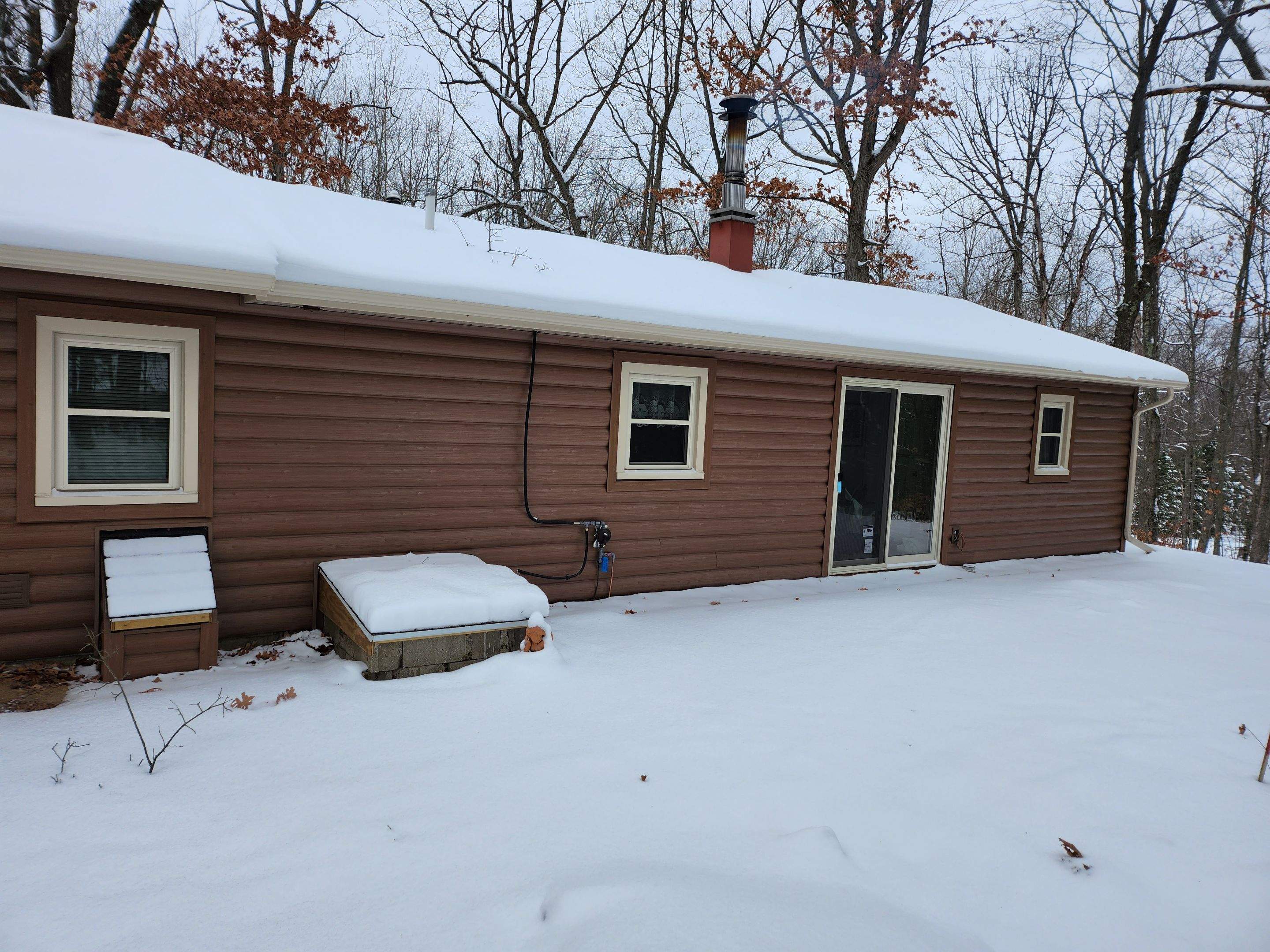 New addition and log siding by Energy Plus Home Improvements