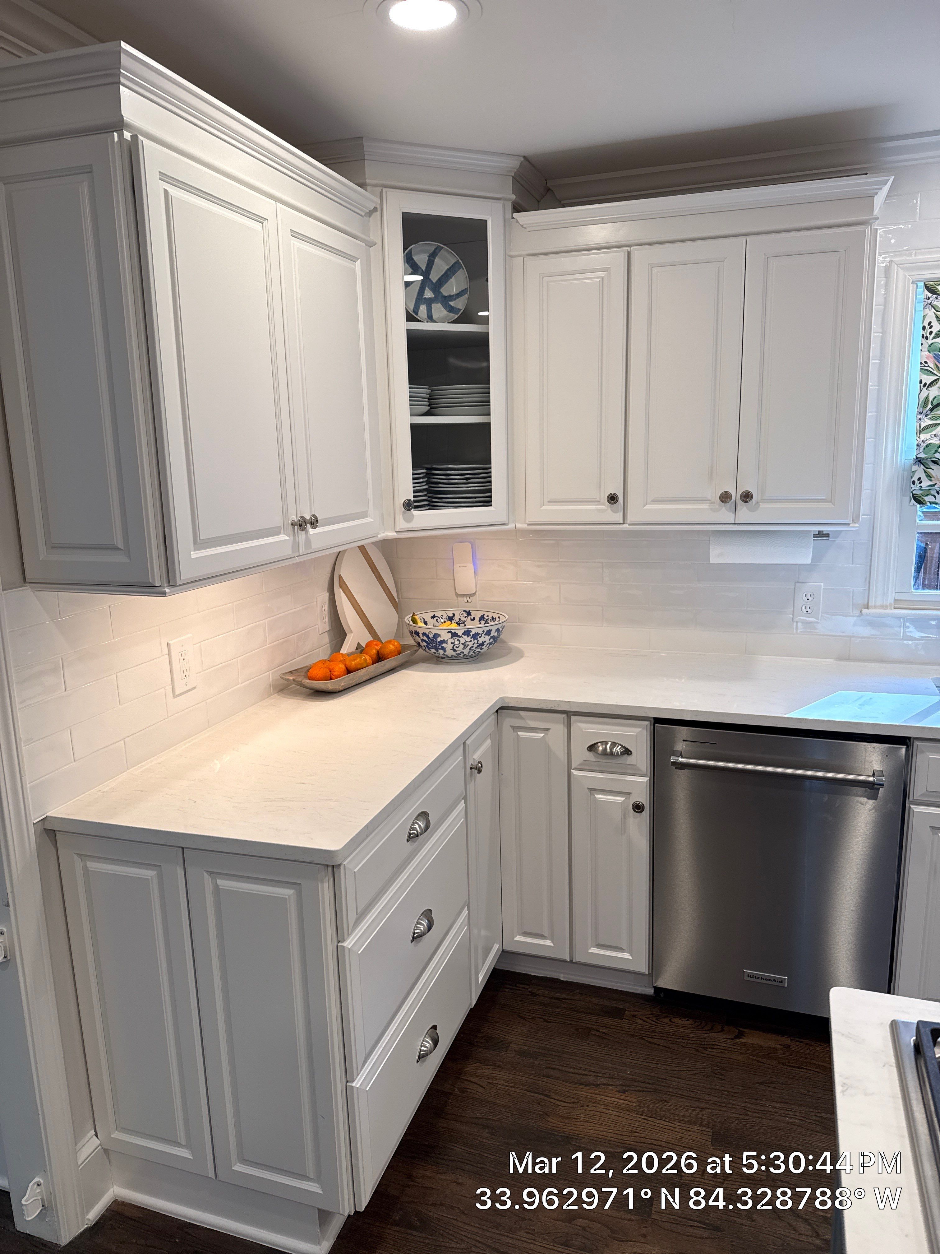 Kitchen Remodel in Dunwoody Featuring White Cabinetry and Blue Island by Heart & Home Kitchen & Bath Remodeling LLC