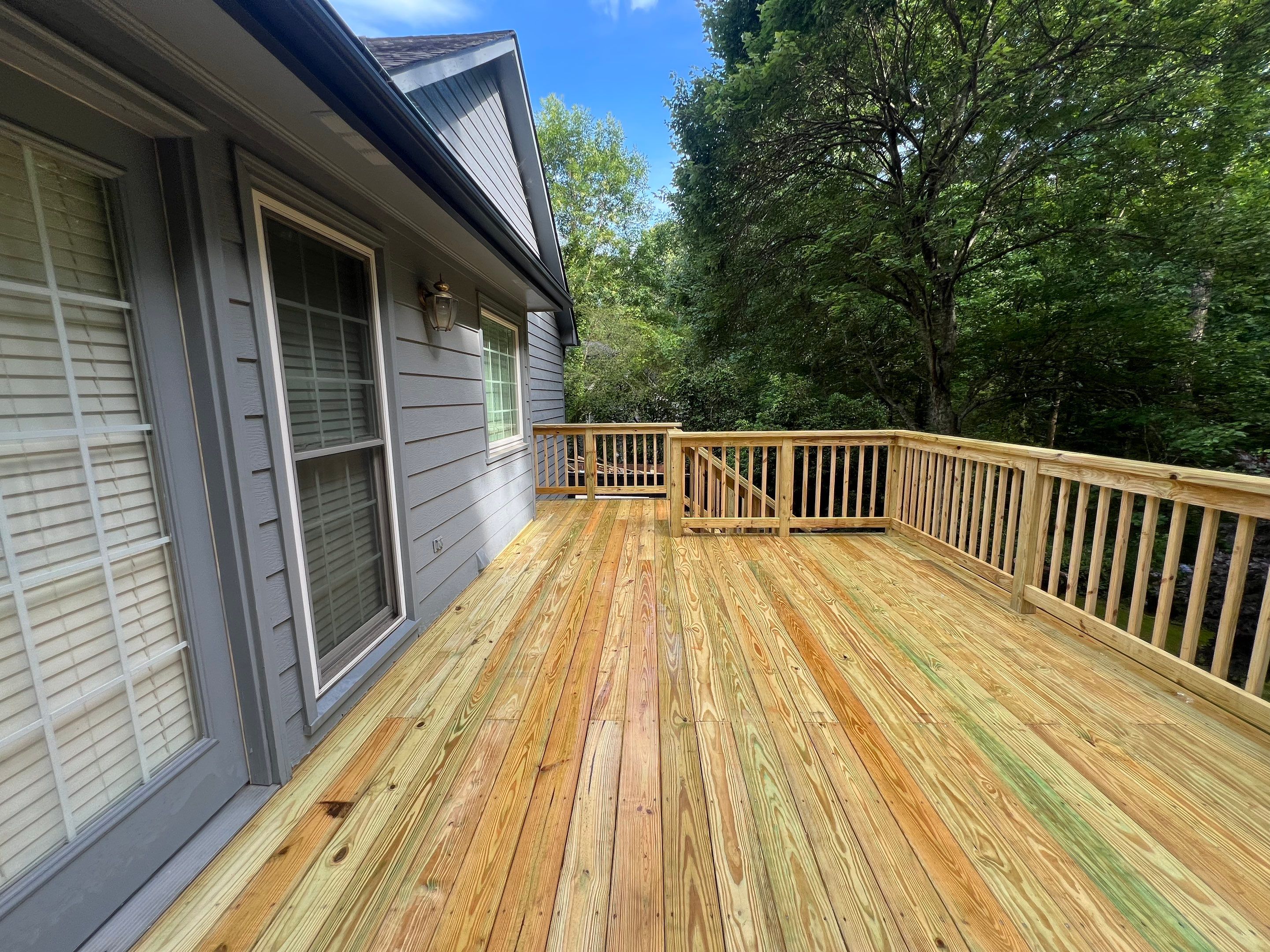 Pressure-Treated Wood Deck Replacement and Staircase Installation in Kennesaw by Swift Home Renovations