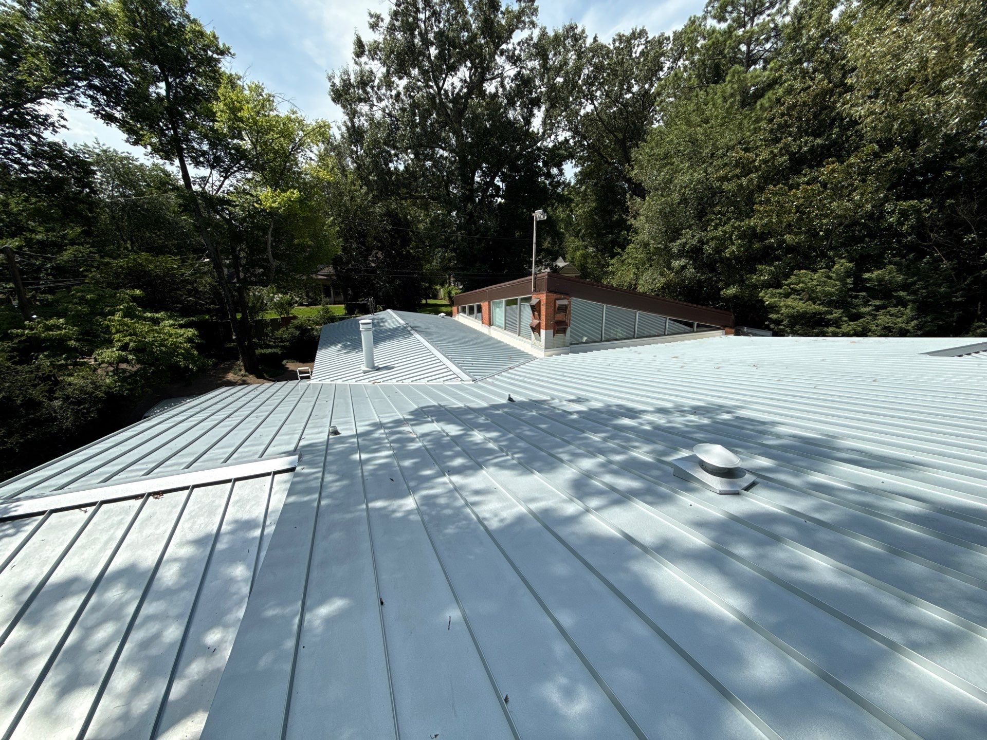 Residential Standing Seam Metal Roof and Membrane Replacement in Memphis by Revival Roofing Services