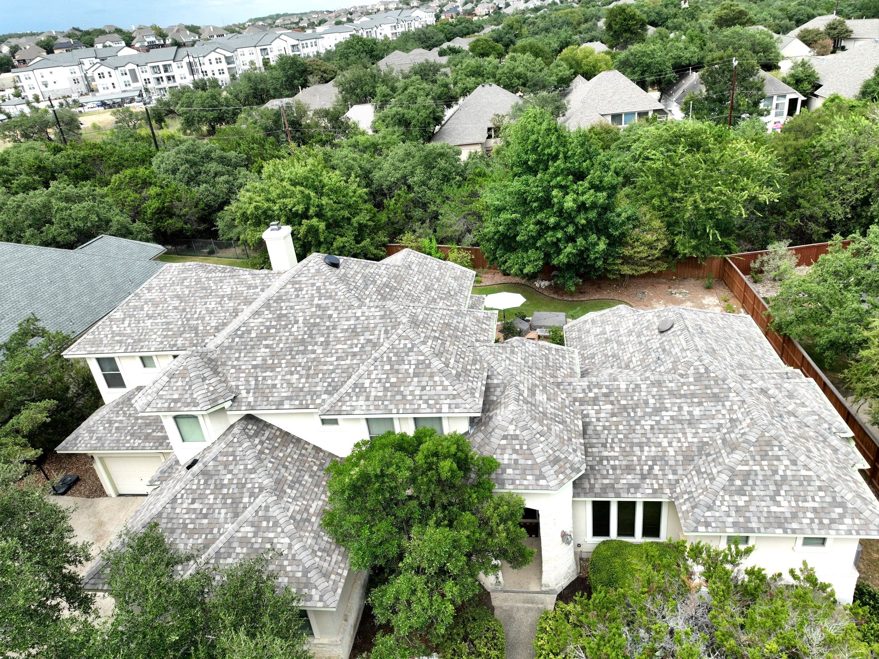 Residential Roof Replacement using 30 Year Laminate Shingles with High Profile Ridge by Premier Roofing and Contracting