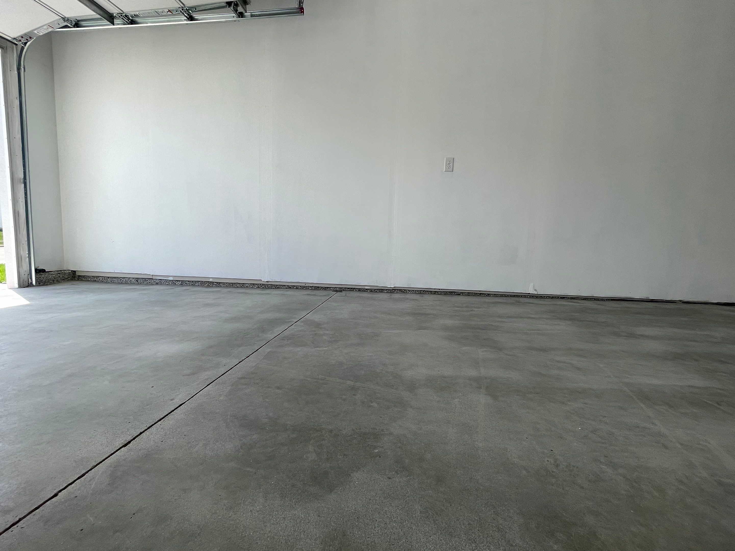 Sioux Falls Garage Floor Transformation with Cabin Fever Decorative Chips by Select Painting, Coatings & Garage Cabinets