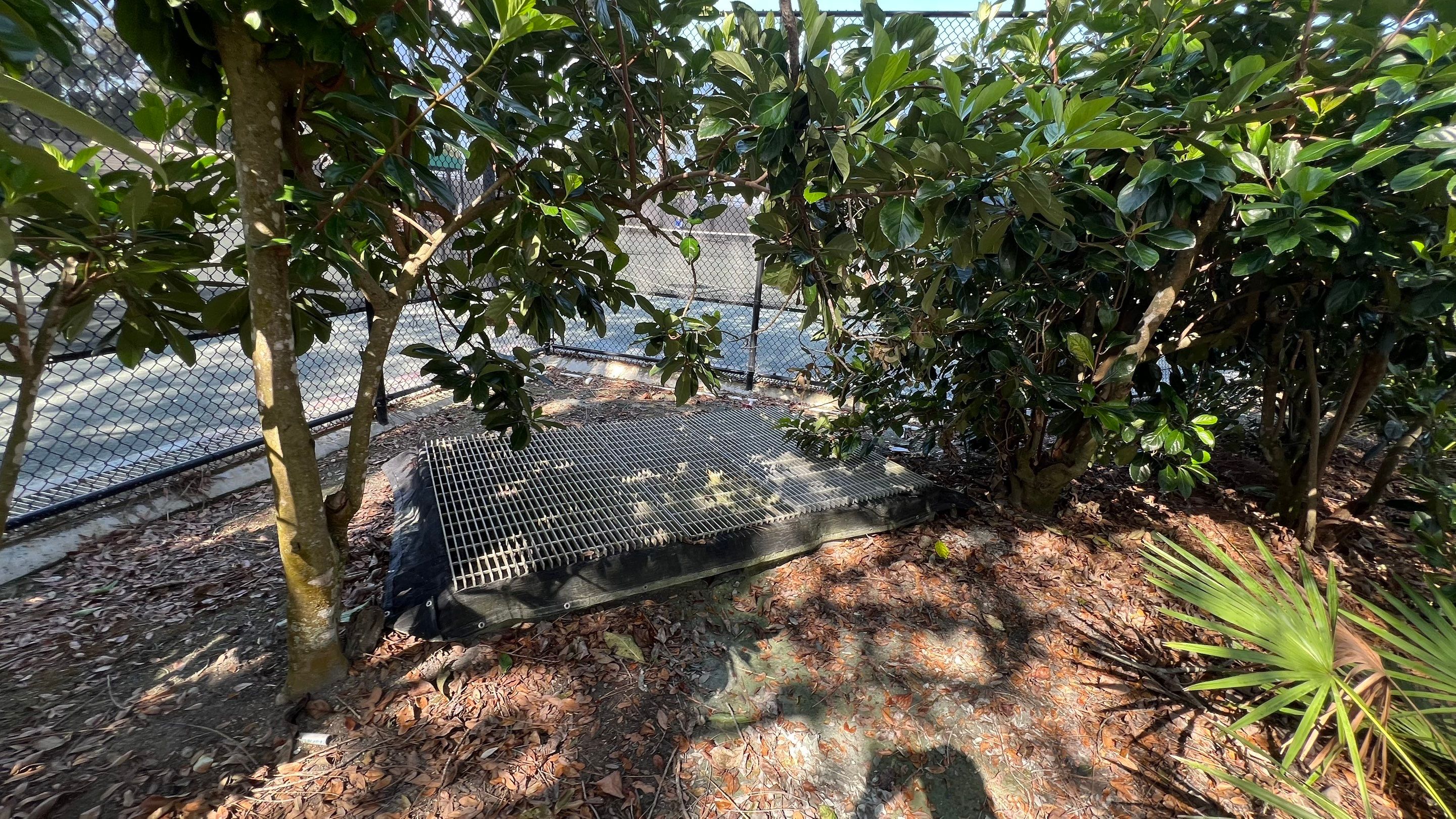 Pelican Landing Tennis Court Catch Basin Cleaning by APS Power & Water