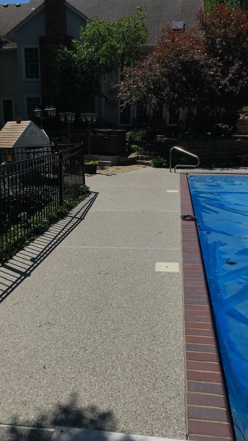 Pool Deck using Pebble Beach by Select Painting, Coatings & Garage Cabinets