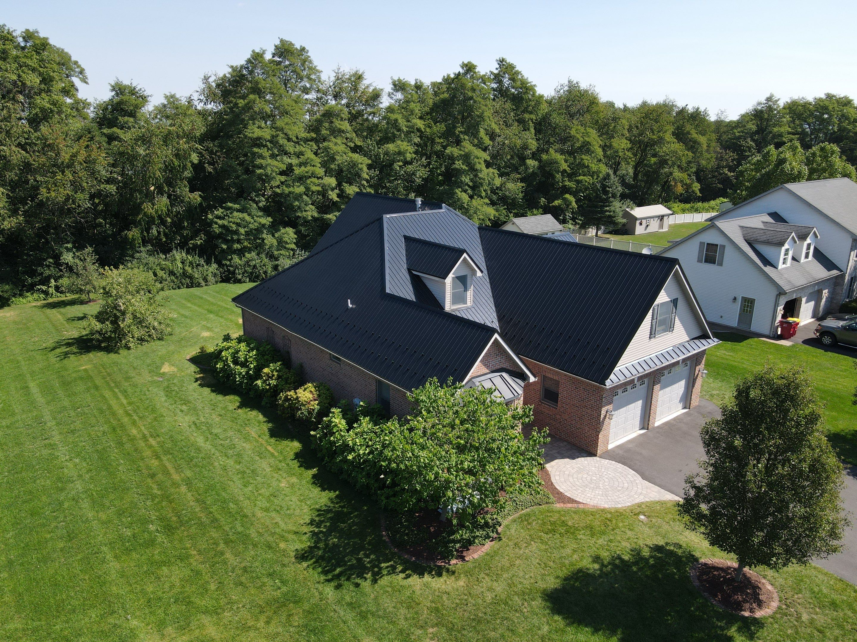 Standing seam / Azm panel in black  by Teflon Roofing