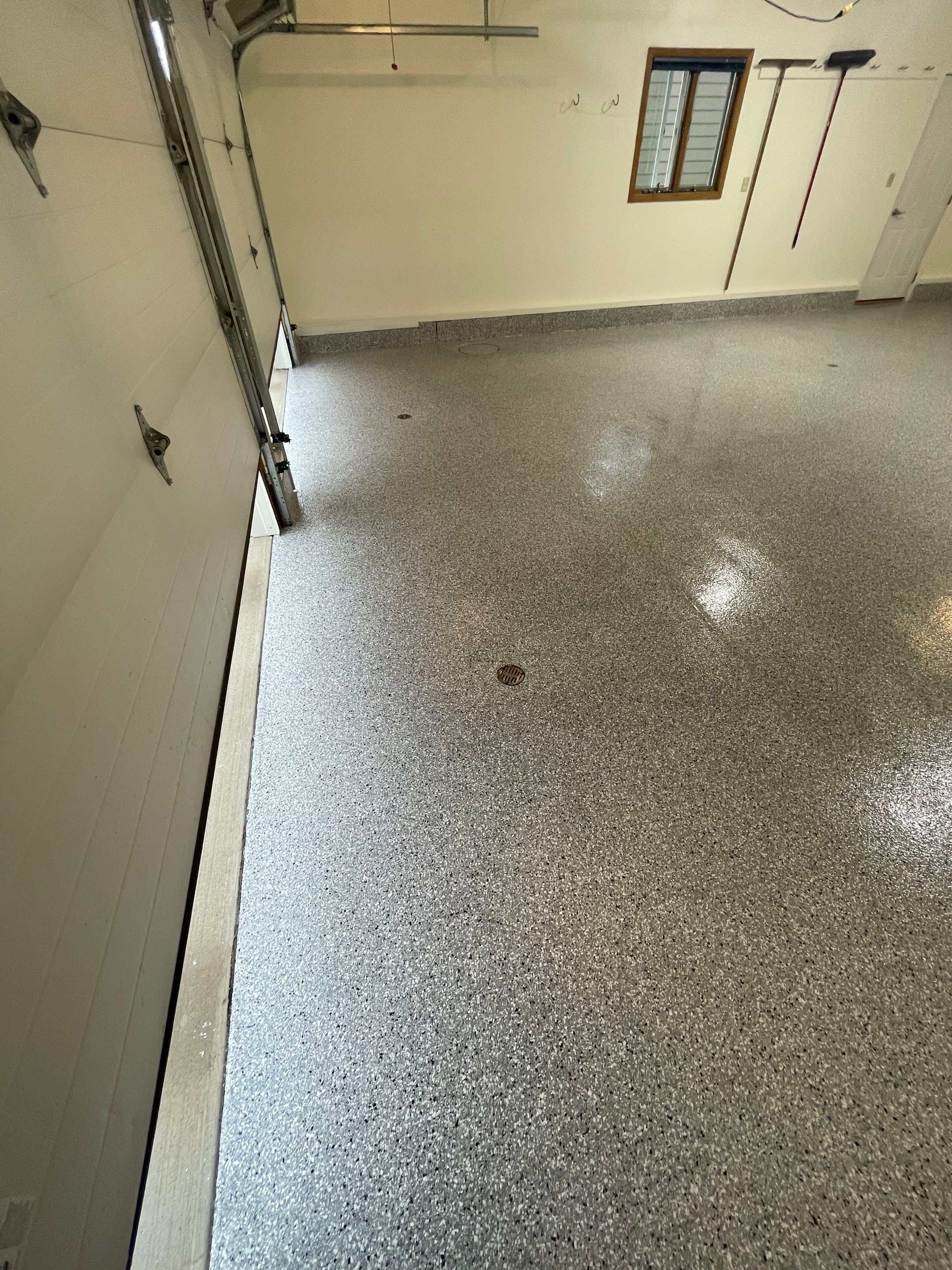 Madison Garage Concrete Coating with Feather Grey Speckle Finish by Select Painting, Coatings & Garage Cabinets