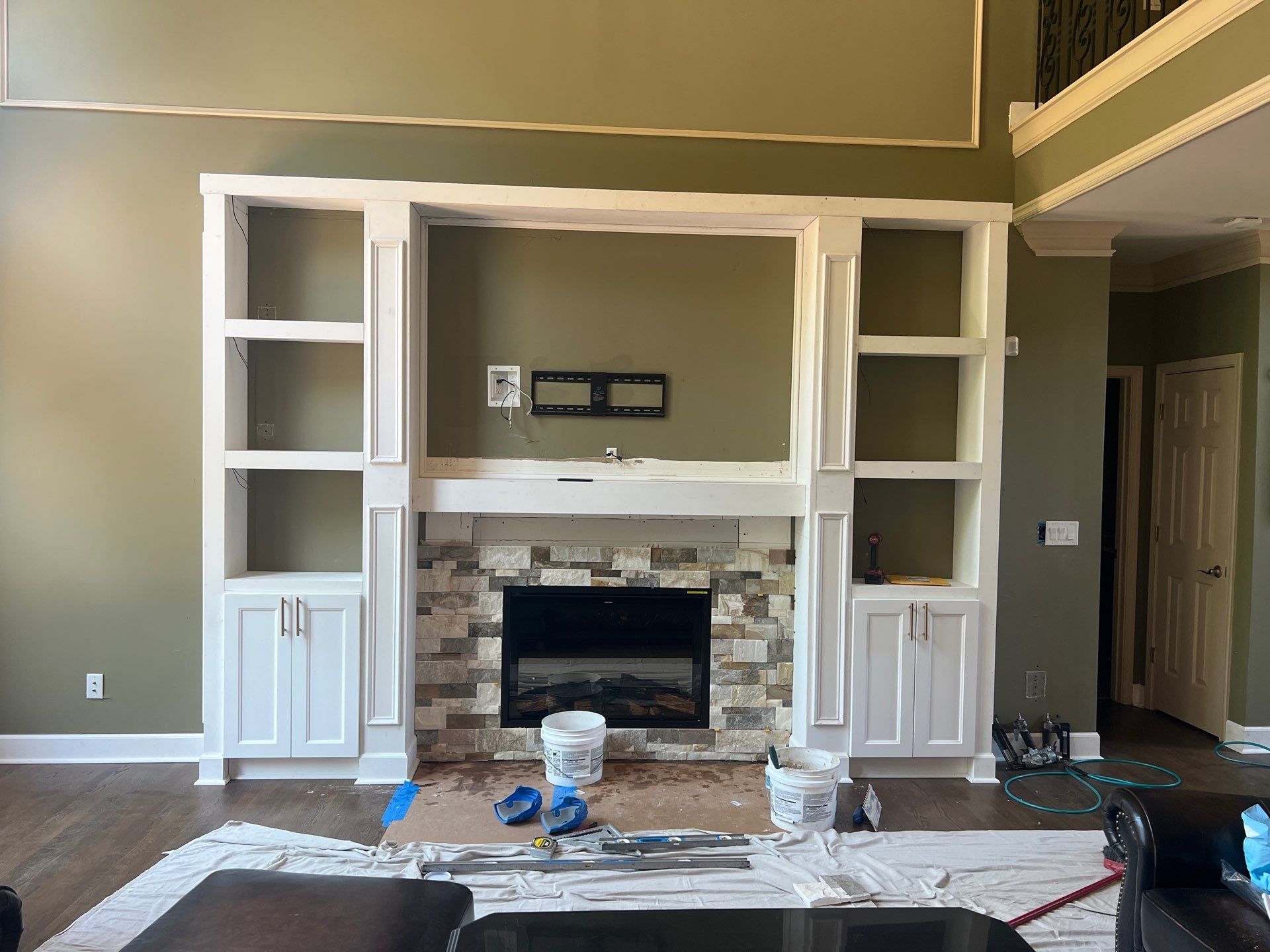 Custom Stone Fireplace and White Built-in Cabinetry in Suwanee by Swift Home Renovations