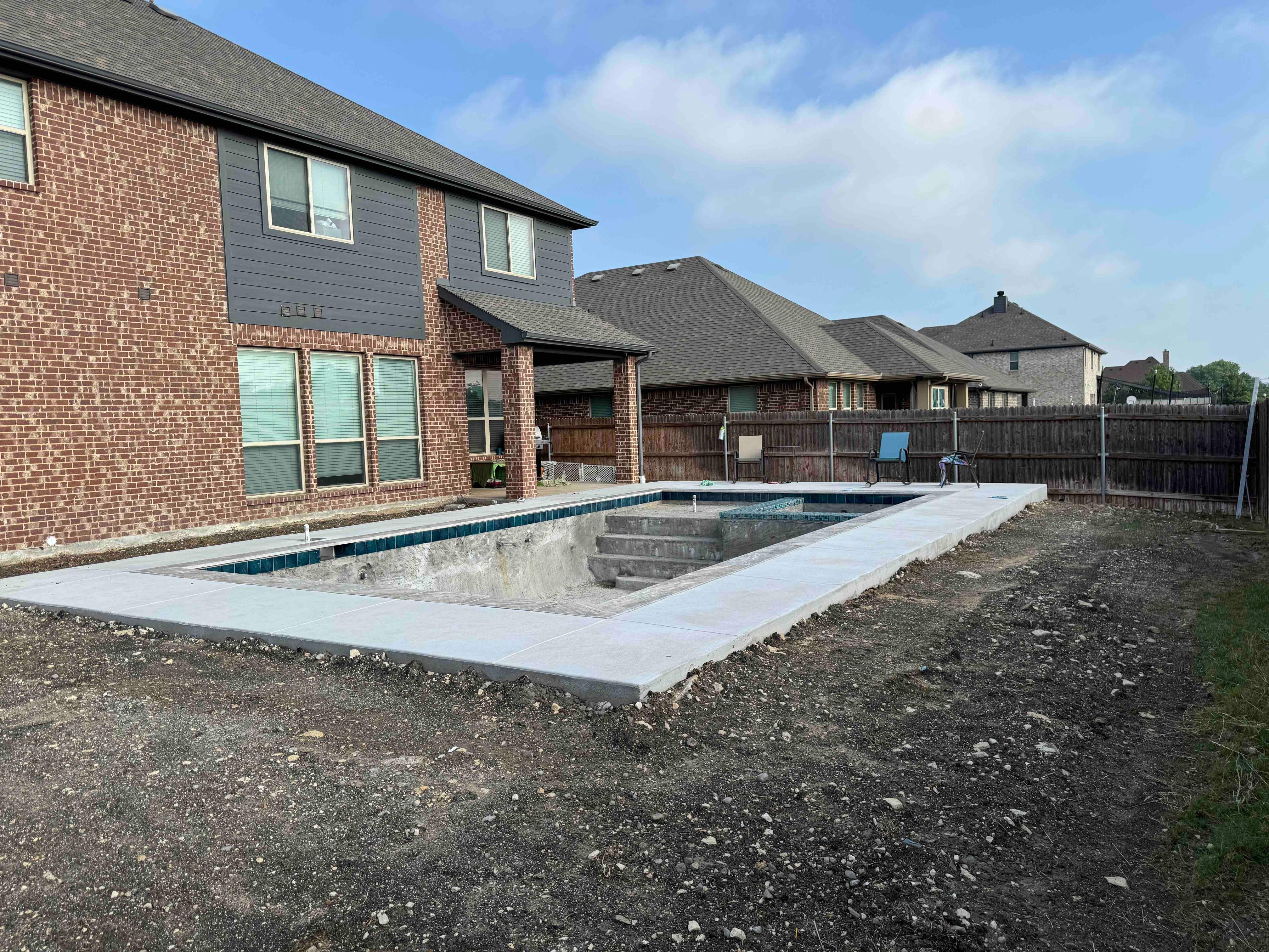 Geometric Pool with Tanning Ledge by Pinnacle Pools and Spas - DFW