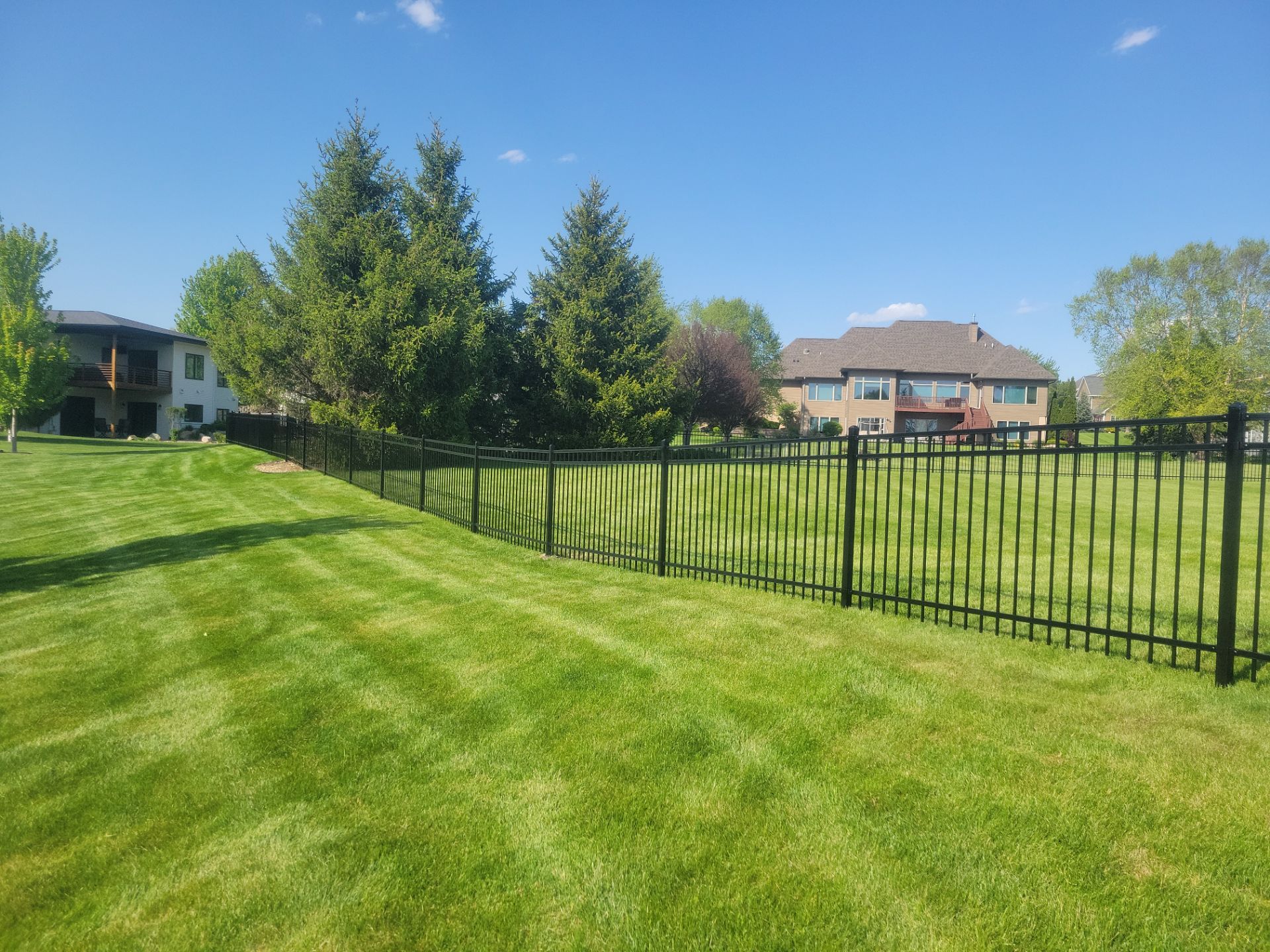 Black Ornamental Metal Picket Fence Installation in Waterloo by Perfect Picket Fence and Stain