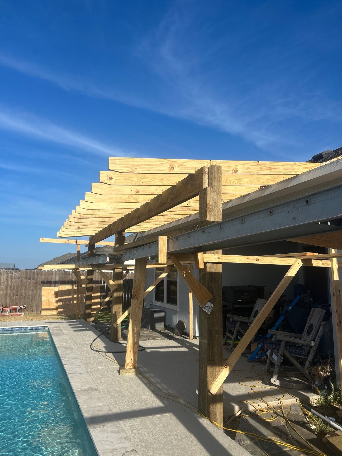 Patio Pool Cover by Bayfront Roofing and Construction