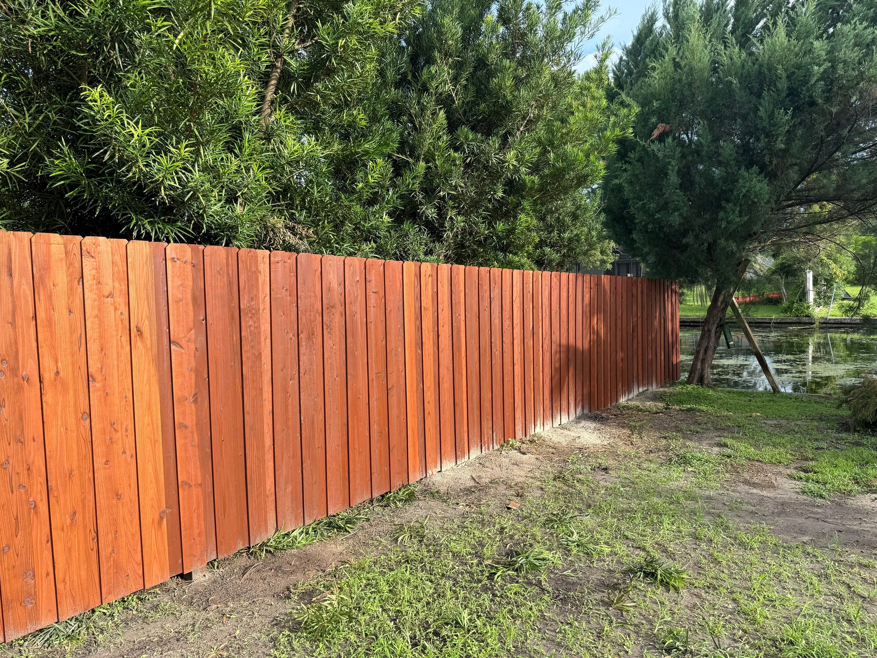 Waterfront Stained Board on Board Privacy Fence In Orlando by Asap fence and gates, LLC