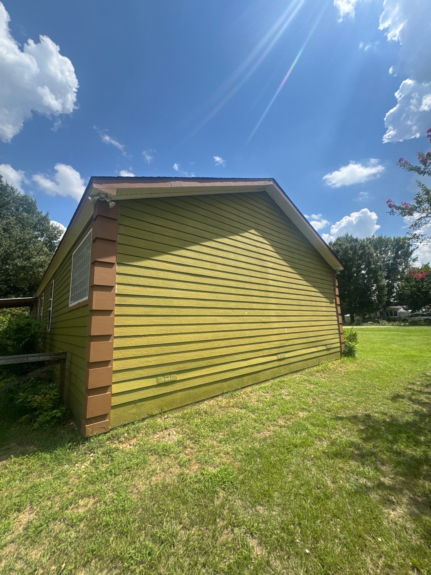 Exterior Painting in Lindale, TX | Bright Green Wood House Repaint by Quality Coats Painting