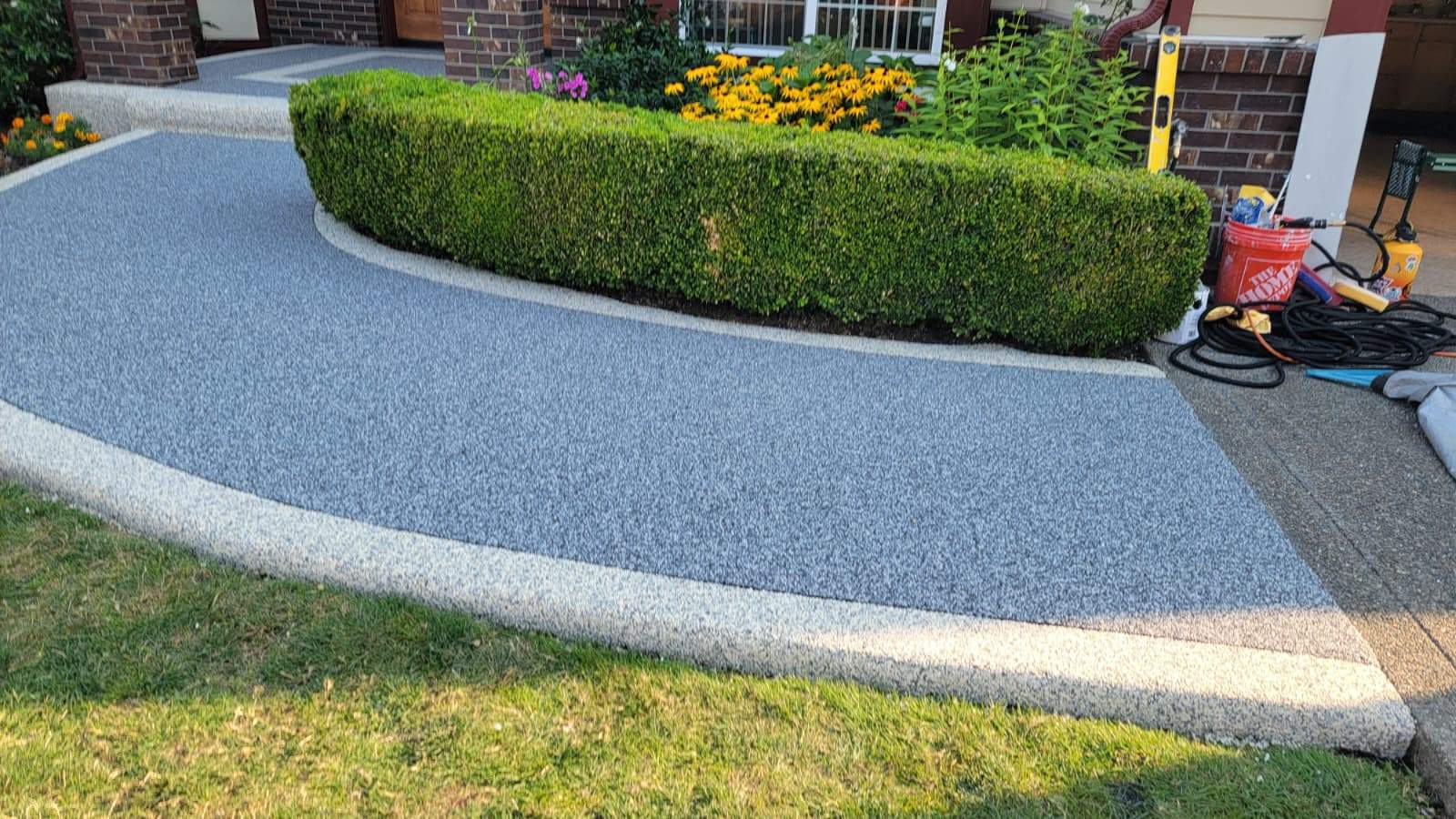 Elegant Walkway and Patio in Palazzo and Santorini Vuba Stone  by Concrete Coating Experts Inc.