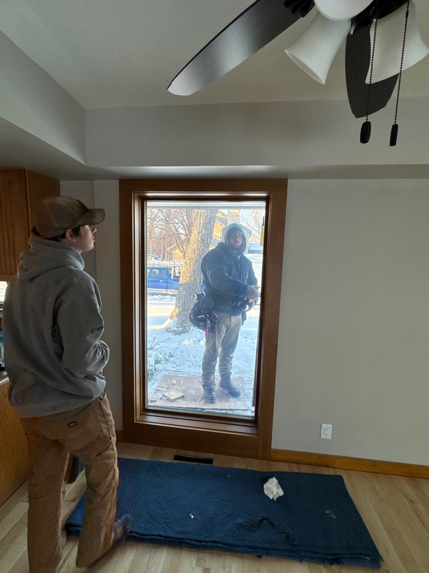 Black-Frame Pella Lifestyle Upgrade on a Partial Brick Home by United Windows and Siding LLC