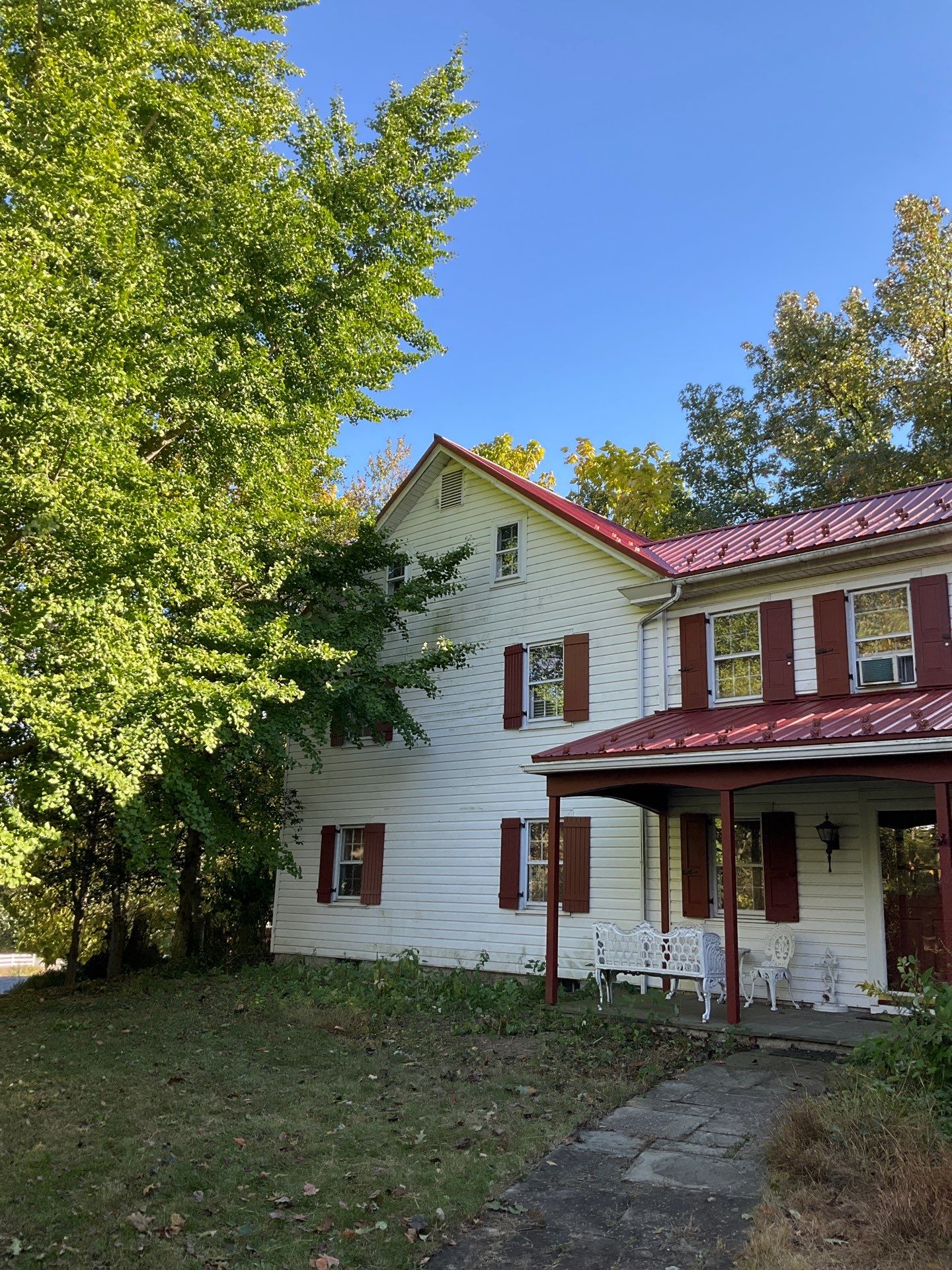 Red Metal Roofing Installation and Trim Restoration in Bernville by Esh Builders