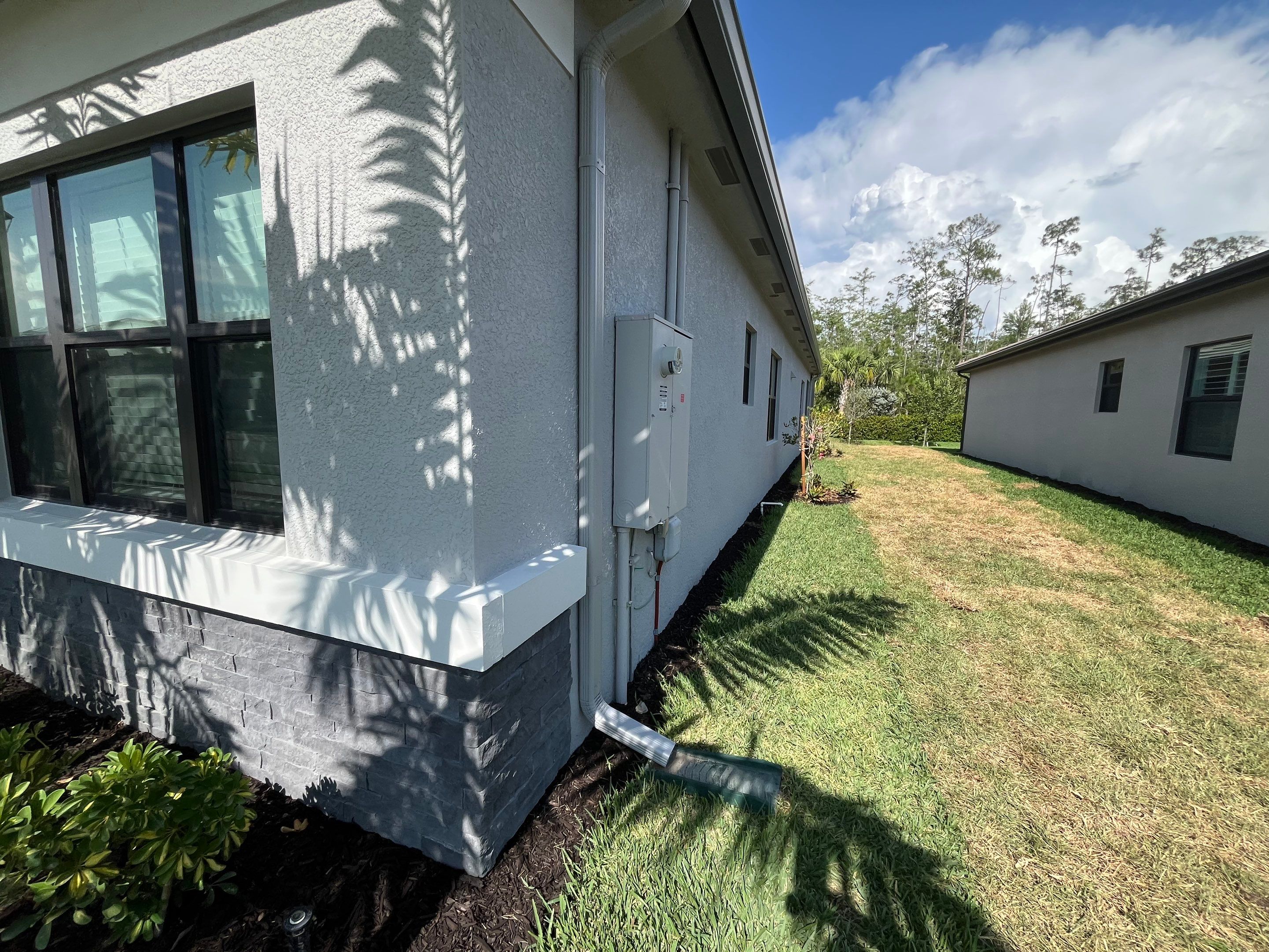 Grey Seamless Gutter Installation in Estero FL by Gutter Professors