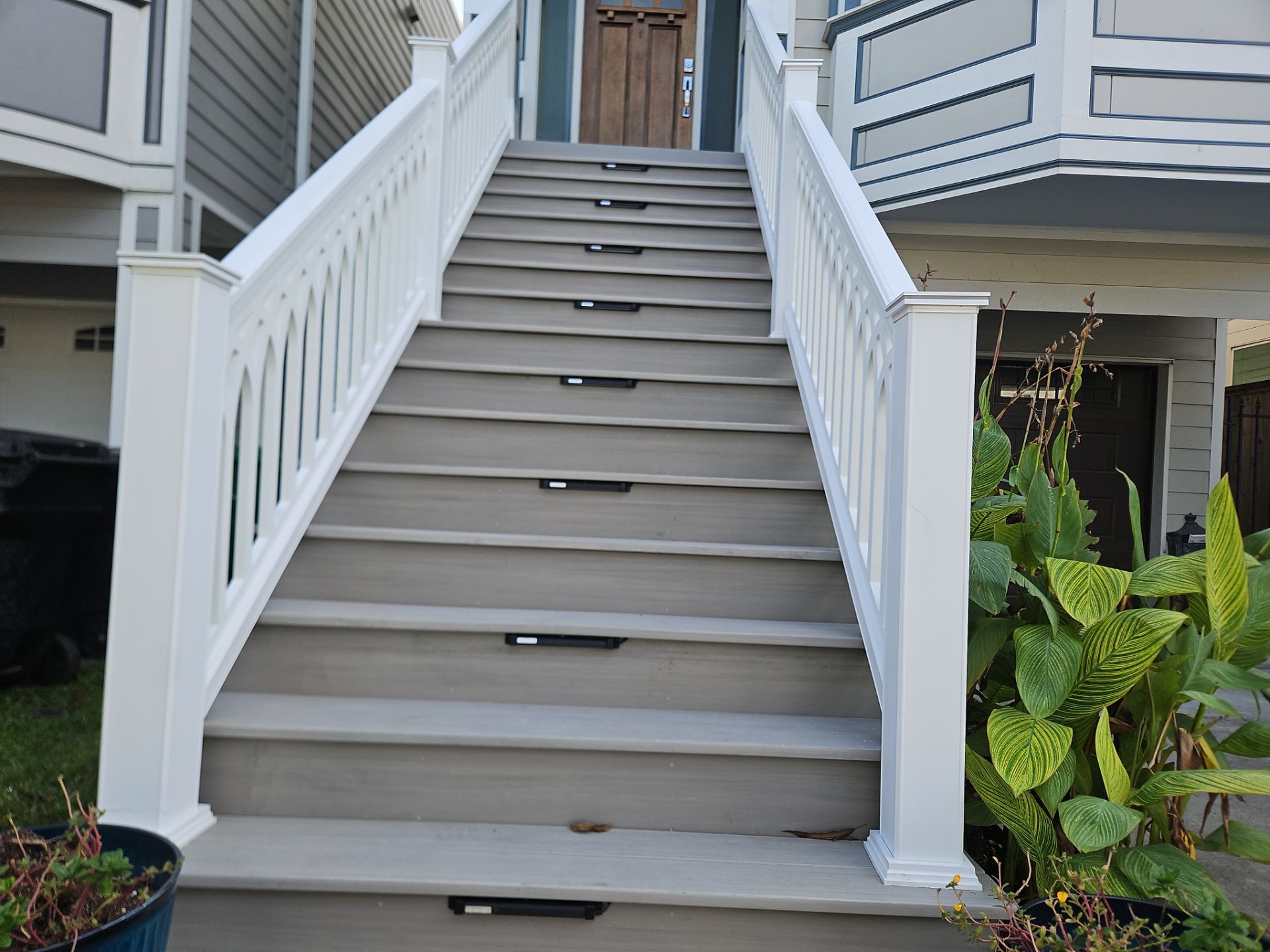 Timbertech Staircase with a 50 year warranty and solar lighting by Majesty Construction