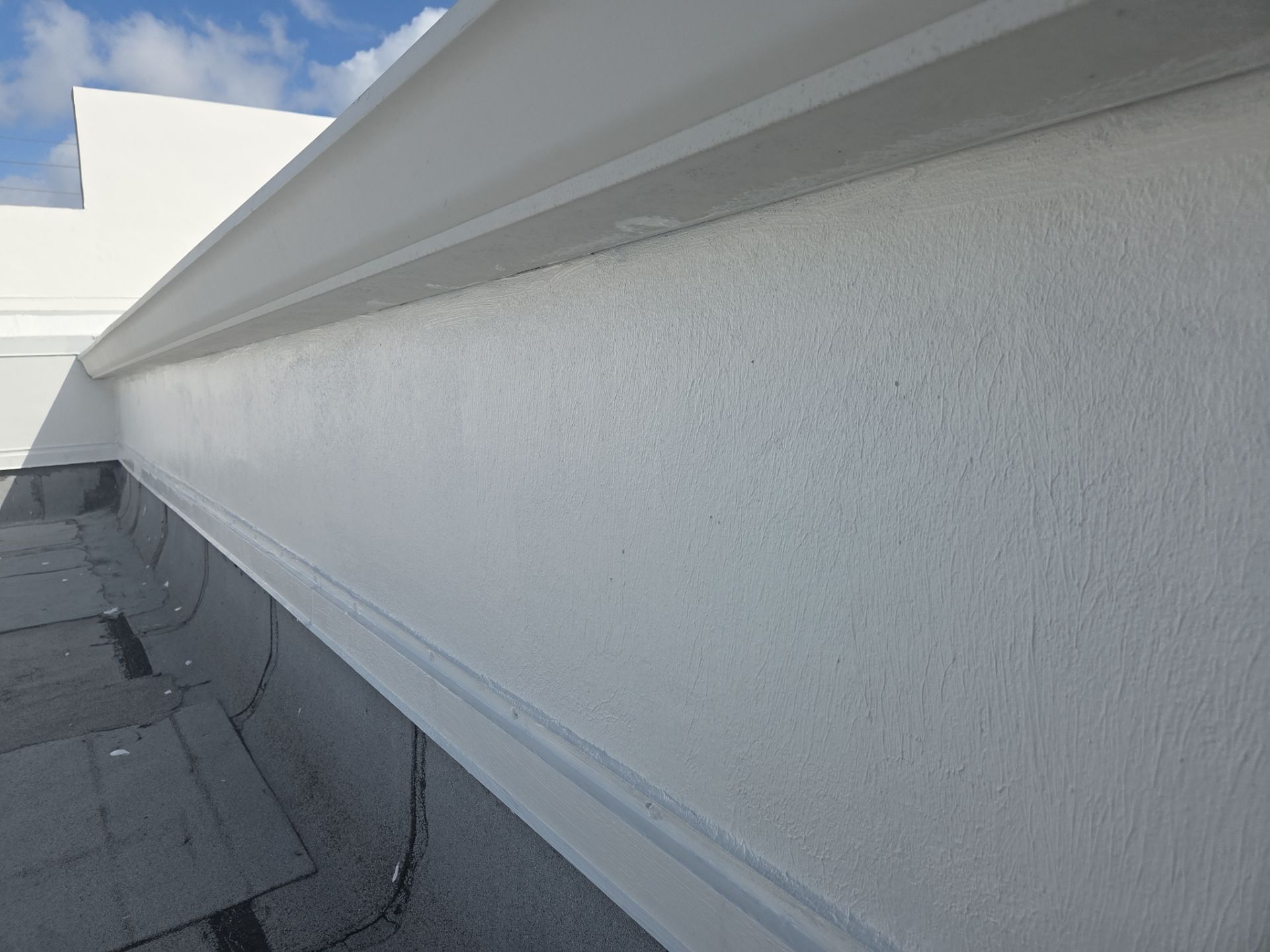 Commercial Flat Roof Restoration Using Silicone Coating in Hallandale Beach by Aastro Roofing
