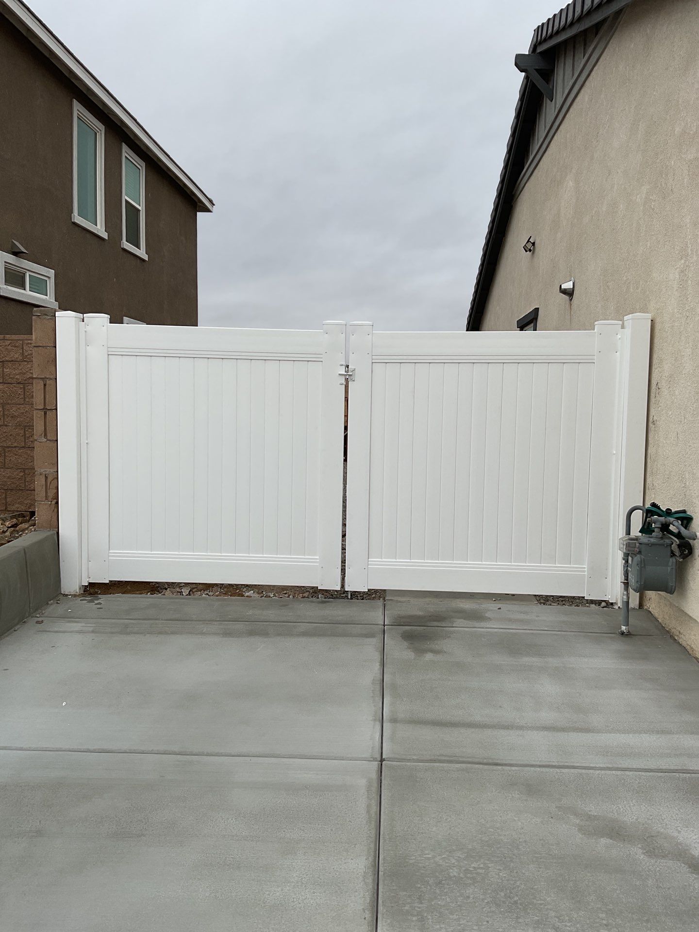 Gate installation using Vinyl by Fence Guys Inc. 