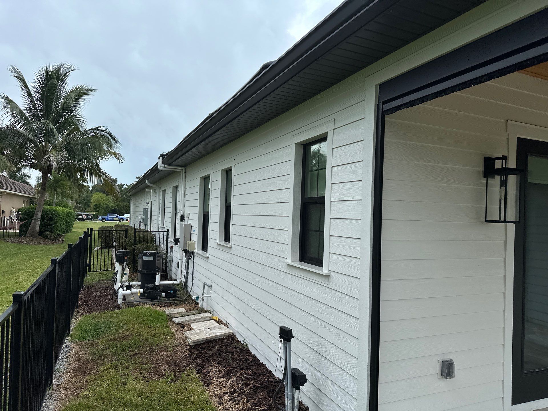 Complete Two-Story House Wash and Driveway Cleaning in Winding River Community, Bradenton, FL by Sunshine AquaWash
