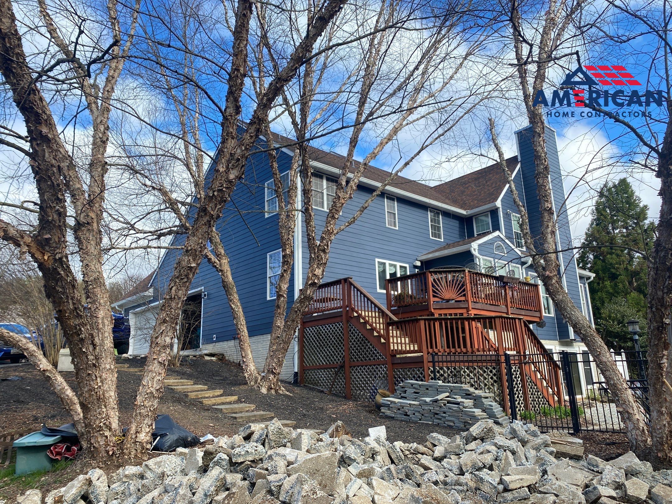James Hardie Plank Siding + Seamless Gutters by American Home Contractors