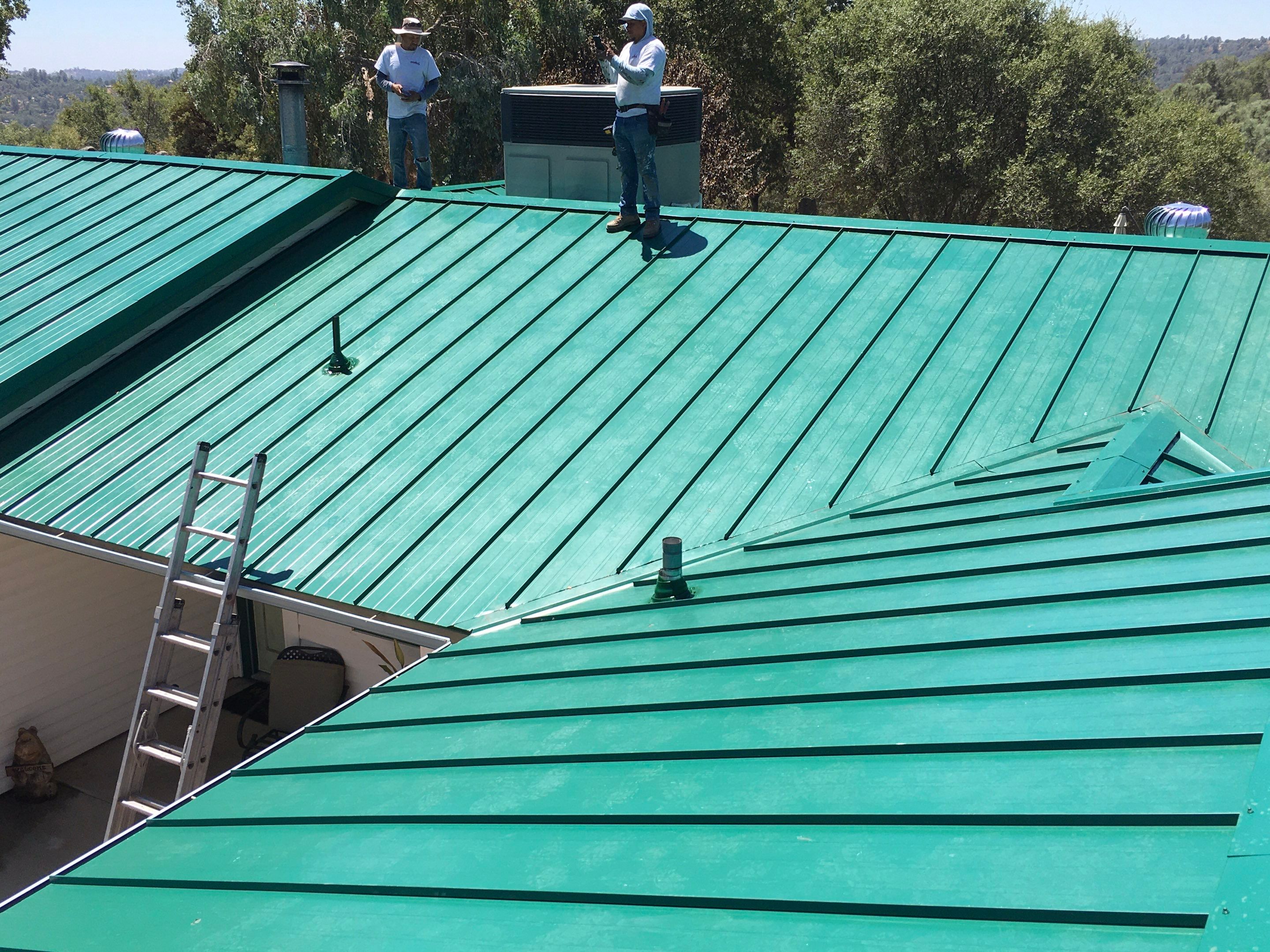 Metal roofing installation using Standing seam metal roofing system by Straight Edge Roofing Inc