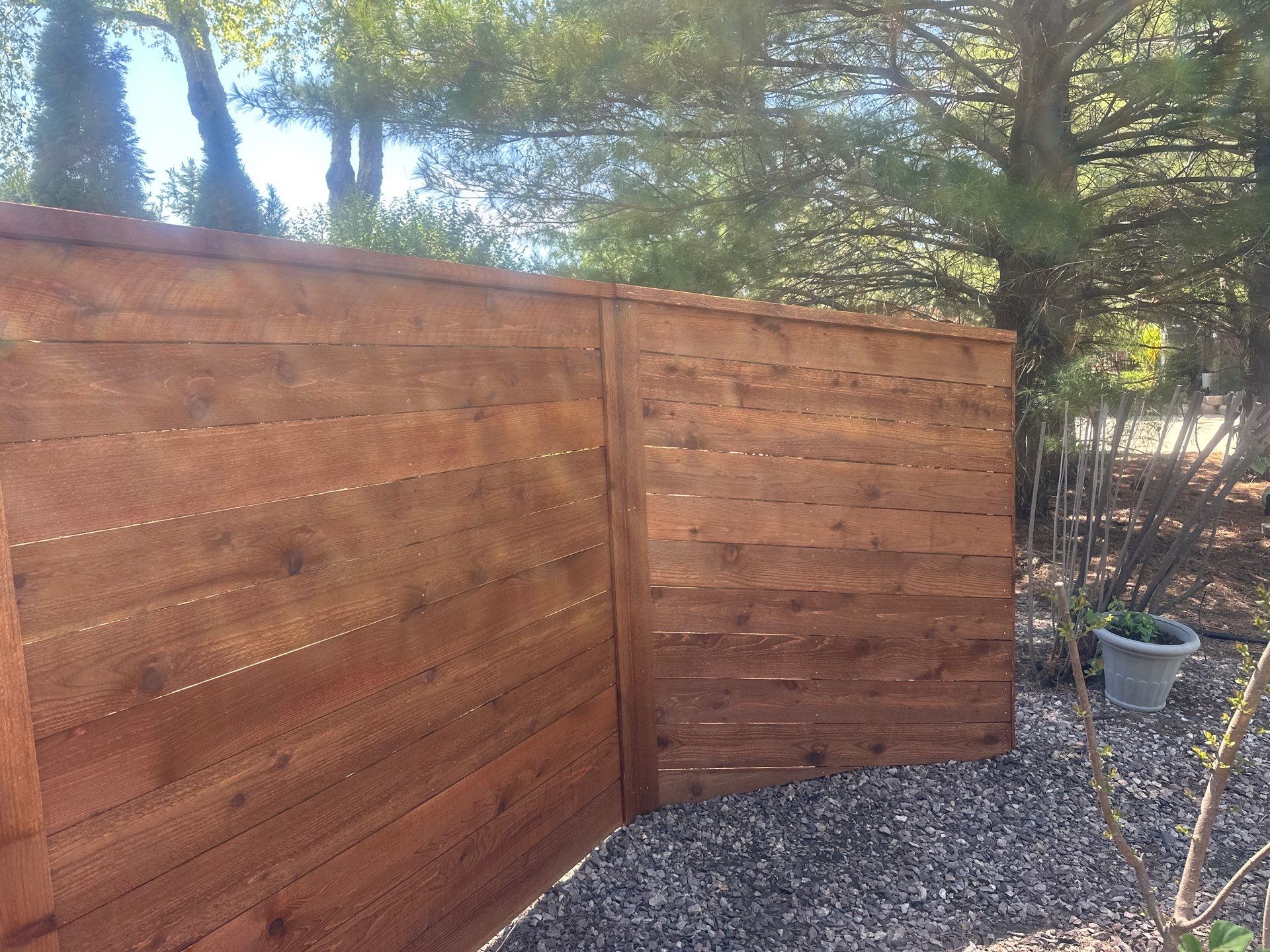 Horizontal Stained Wood Privacy Fence Installation in Waterloo by Perfect Picket Fence and Stain