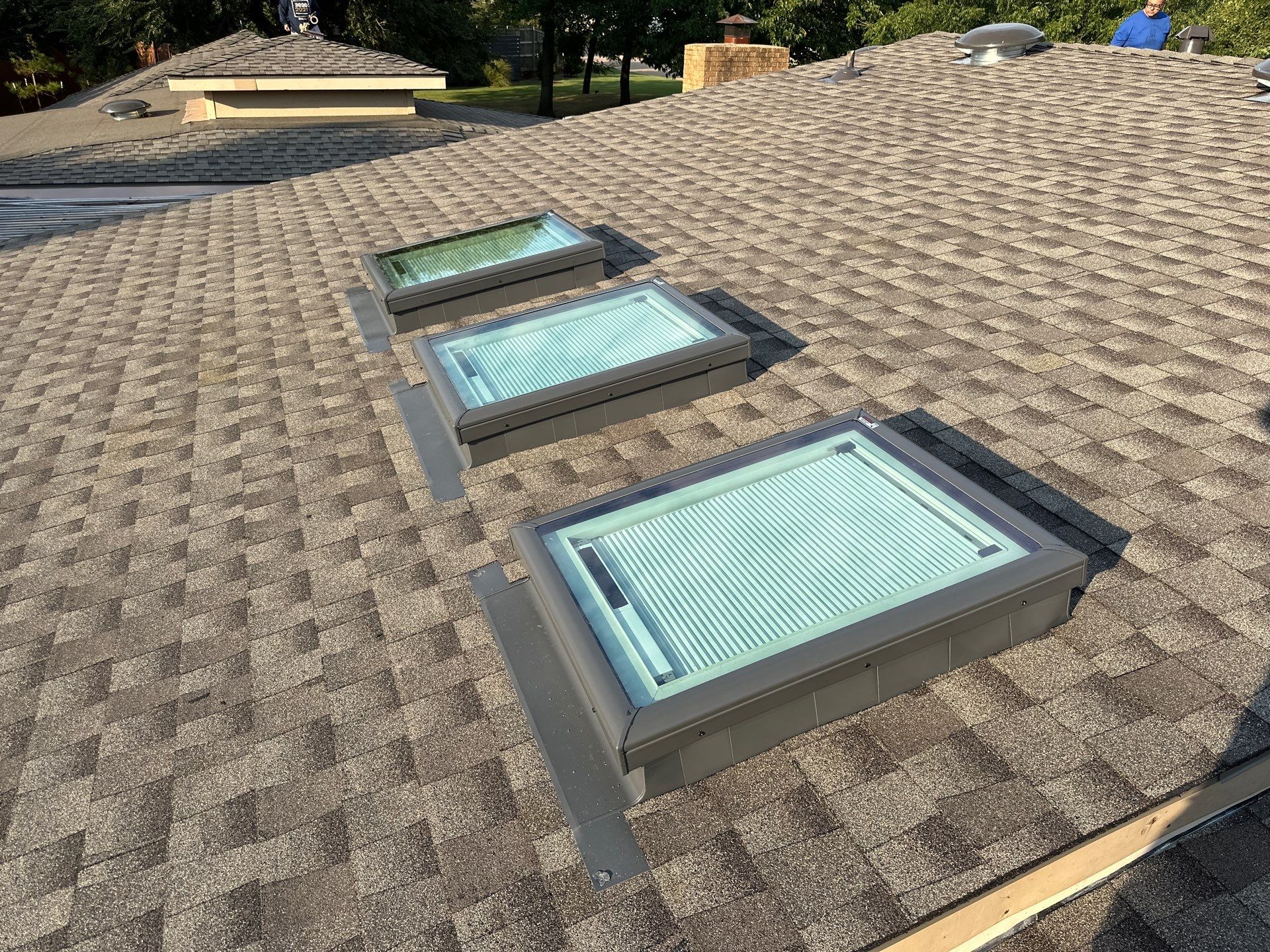 roof replacement, chimney flashing repair, and skylight replacement in Oklahoma City by McCann's Roofing and Construction