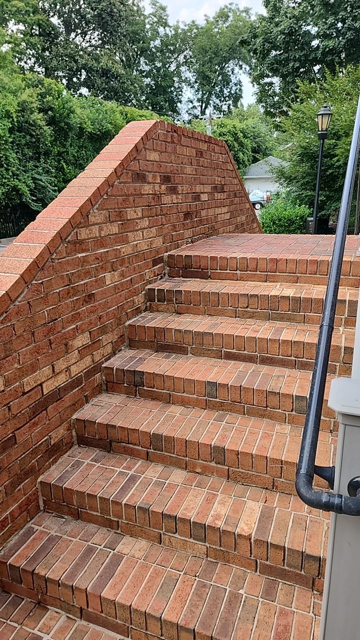building clean using cleaner by Power Wash Masters LLC
