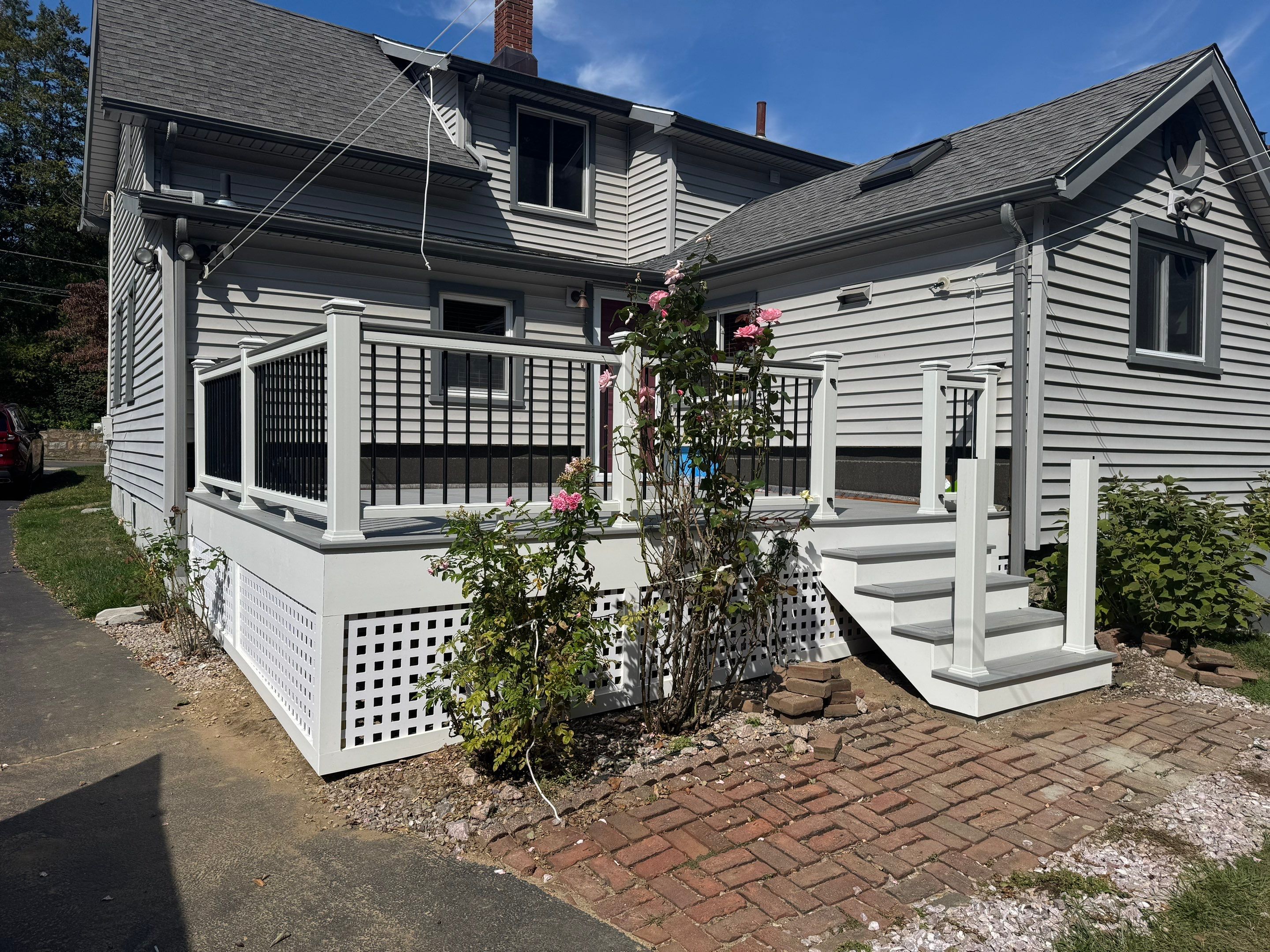 Deck Replacement using Trex Lineage Rainier with matching Cocktail rail and Lattice by DiGiorgi Roofing and Siding Inc