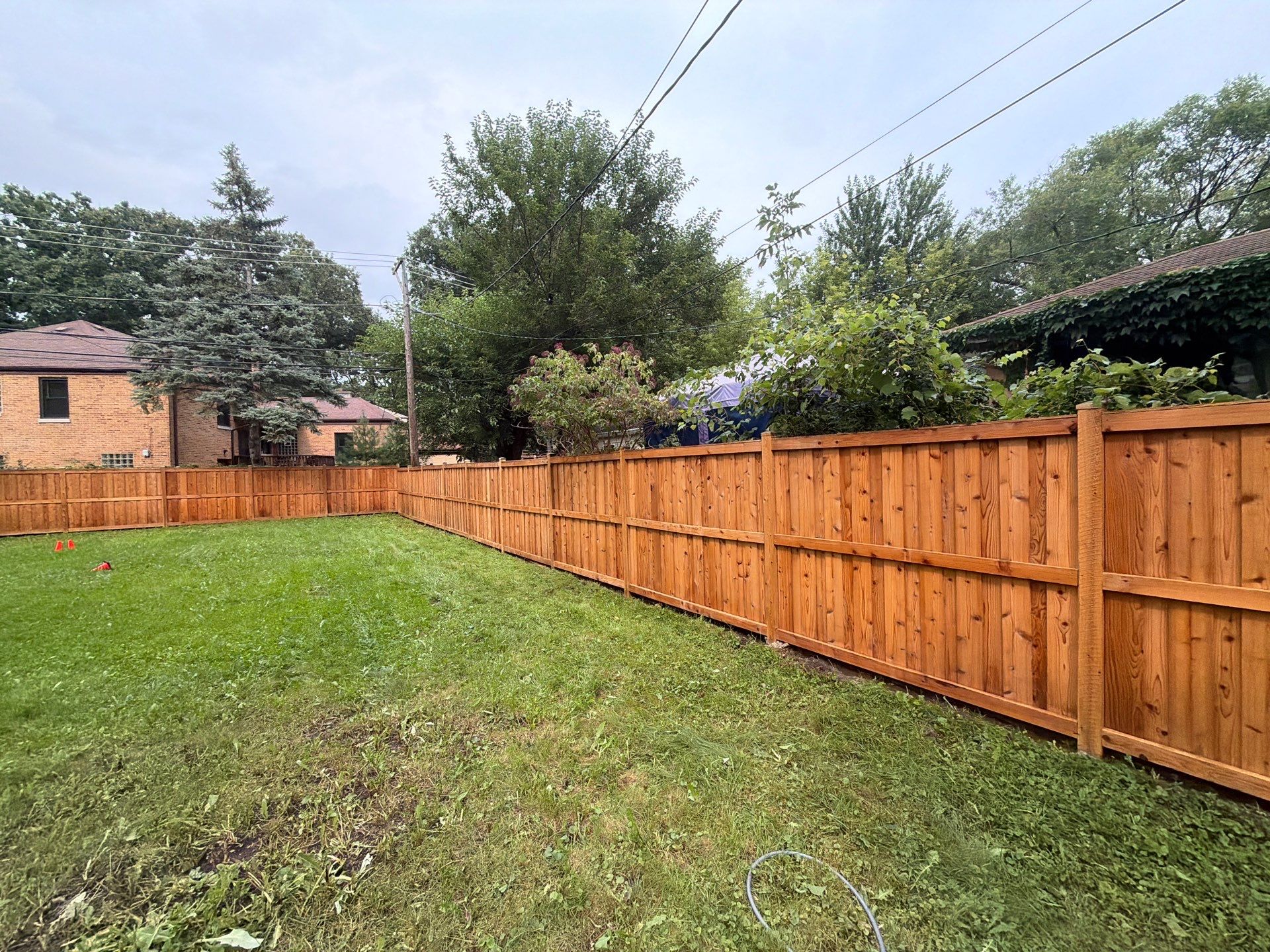 Wood fence cleaning and sealing by Northern Power Washing LLC.