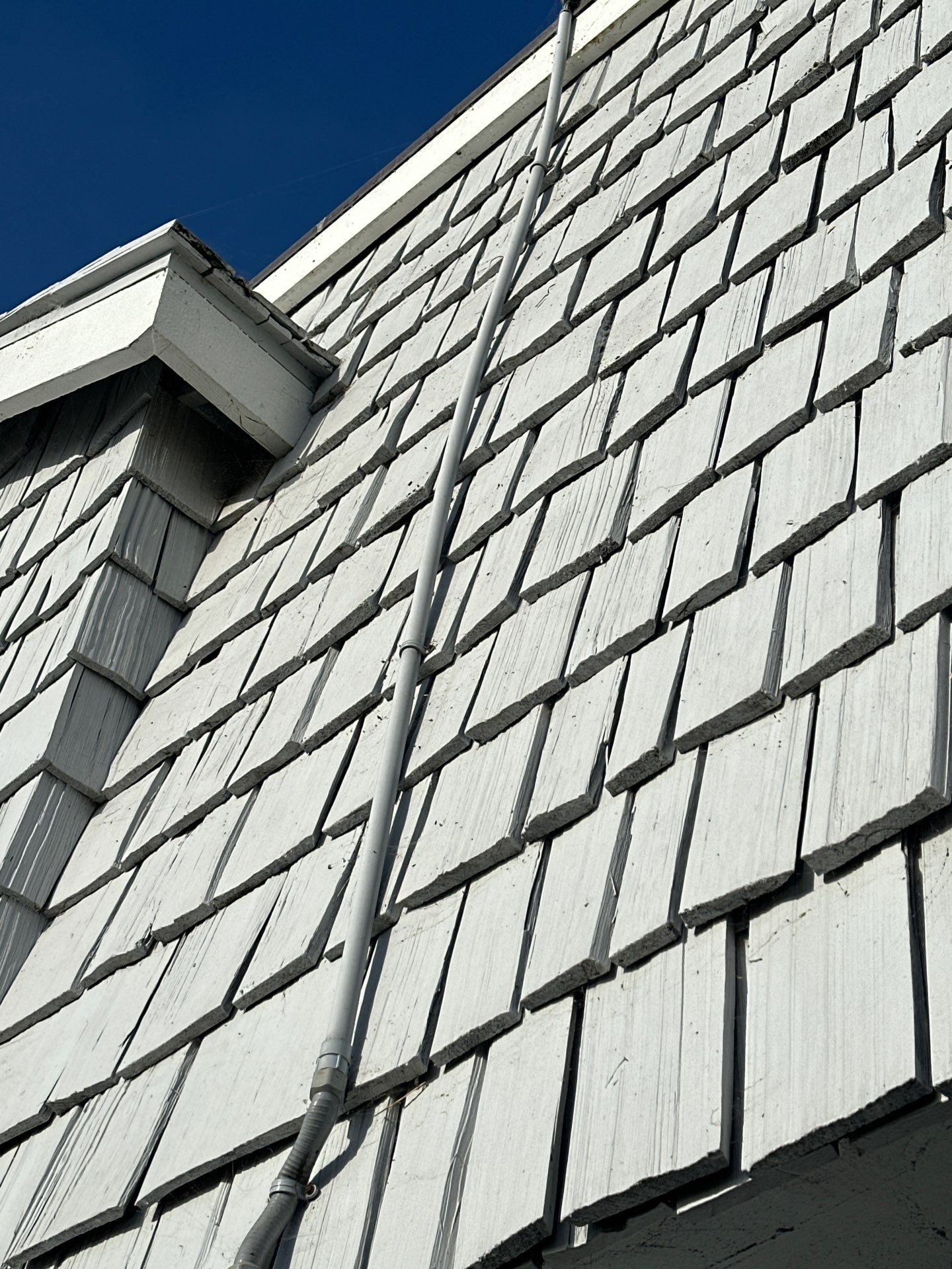 Pre-finish shingles by New Era Siding Inc 