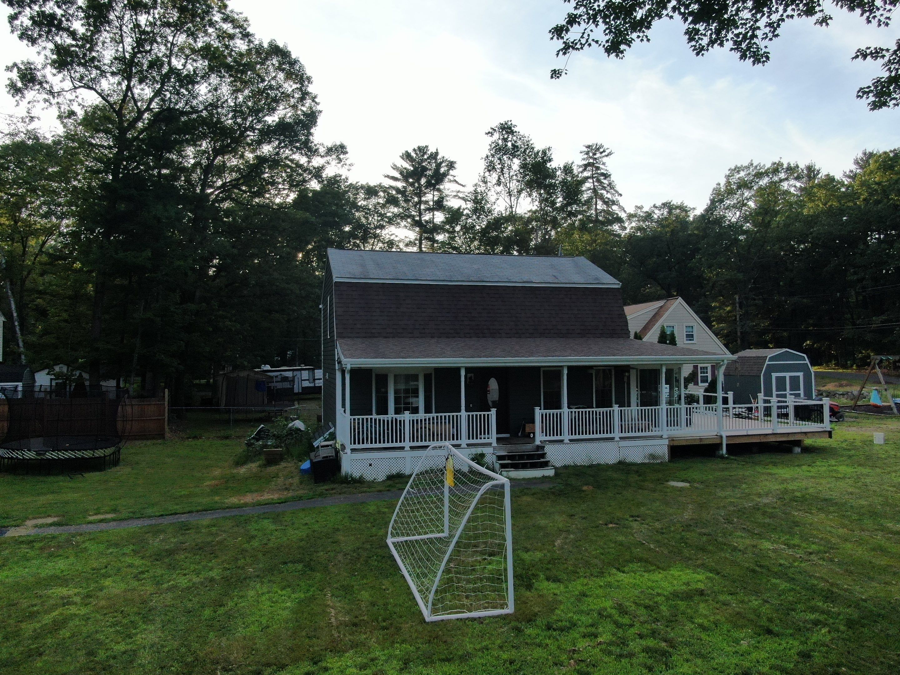 Full Roof Replacement & Farmers Porch Restoration – Asphalt + Standing Seam Metal by Mighty Dog Roofing of Greater Middlesex County