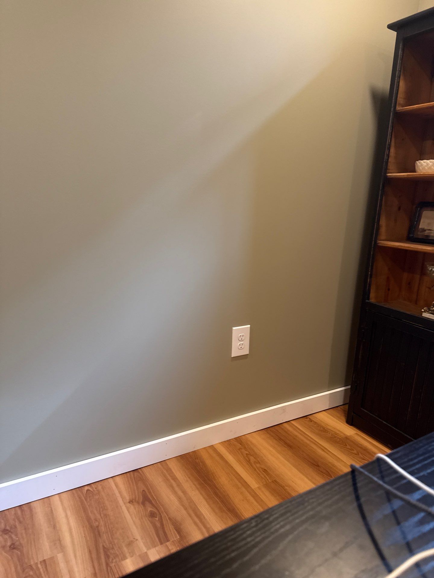 Lincoln Basement Office Renovation with Sage Green Walls and Laminate Flooring by CompanyCam Sales Demo