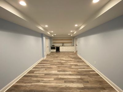 Marietta Basement Remodeling Featuring Custom Wet Bar and Marble Shower