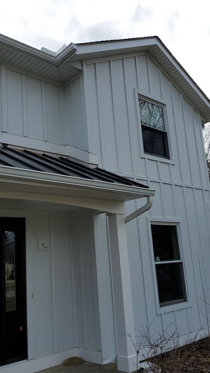 James Hardie Siding  using James Hardie Board and Batten, White by Absolute Roofing and Construction