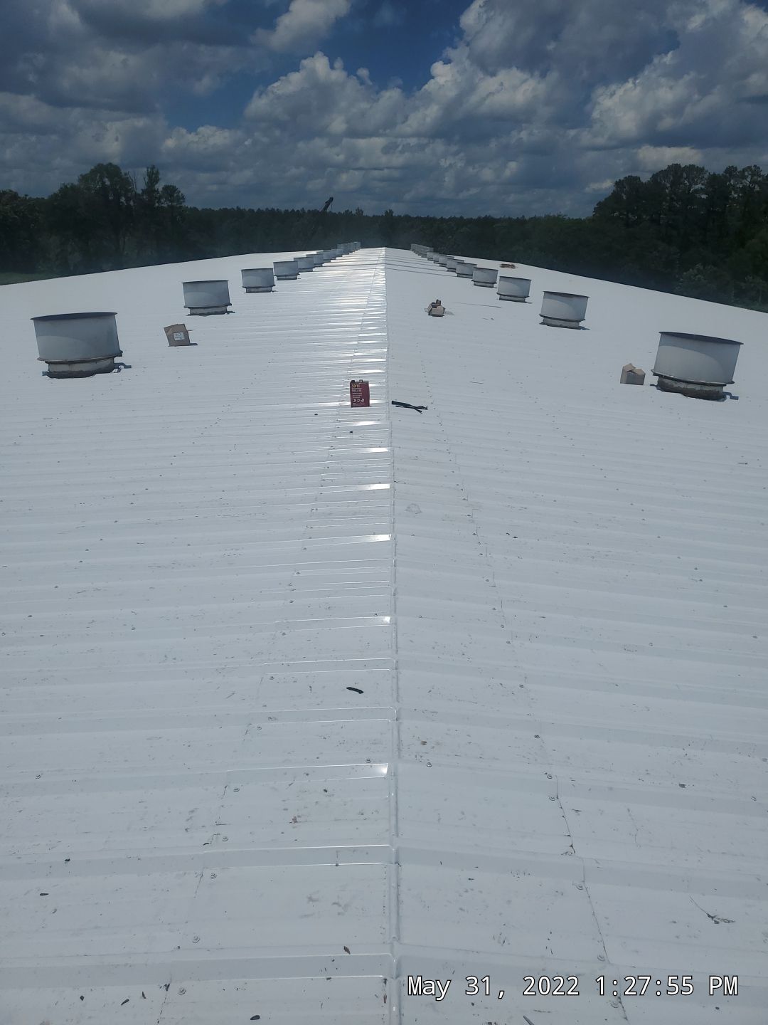 Commercial Roofing Installation using Aluminum Roofing panels by Hostetler Roofing