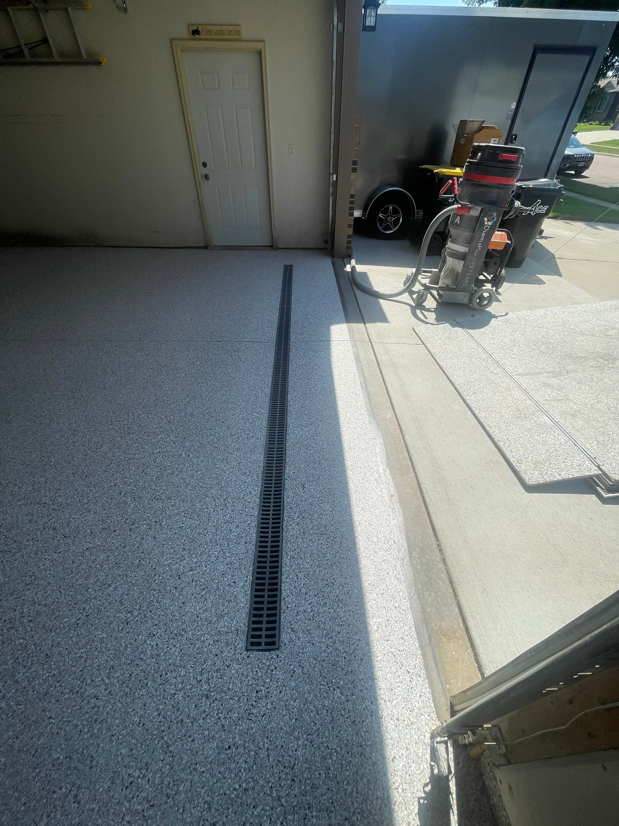Multi-Stall Garage Floor Coating Installation in Sioux Falls by Select Painting, Coatings & Garage Cabinets