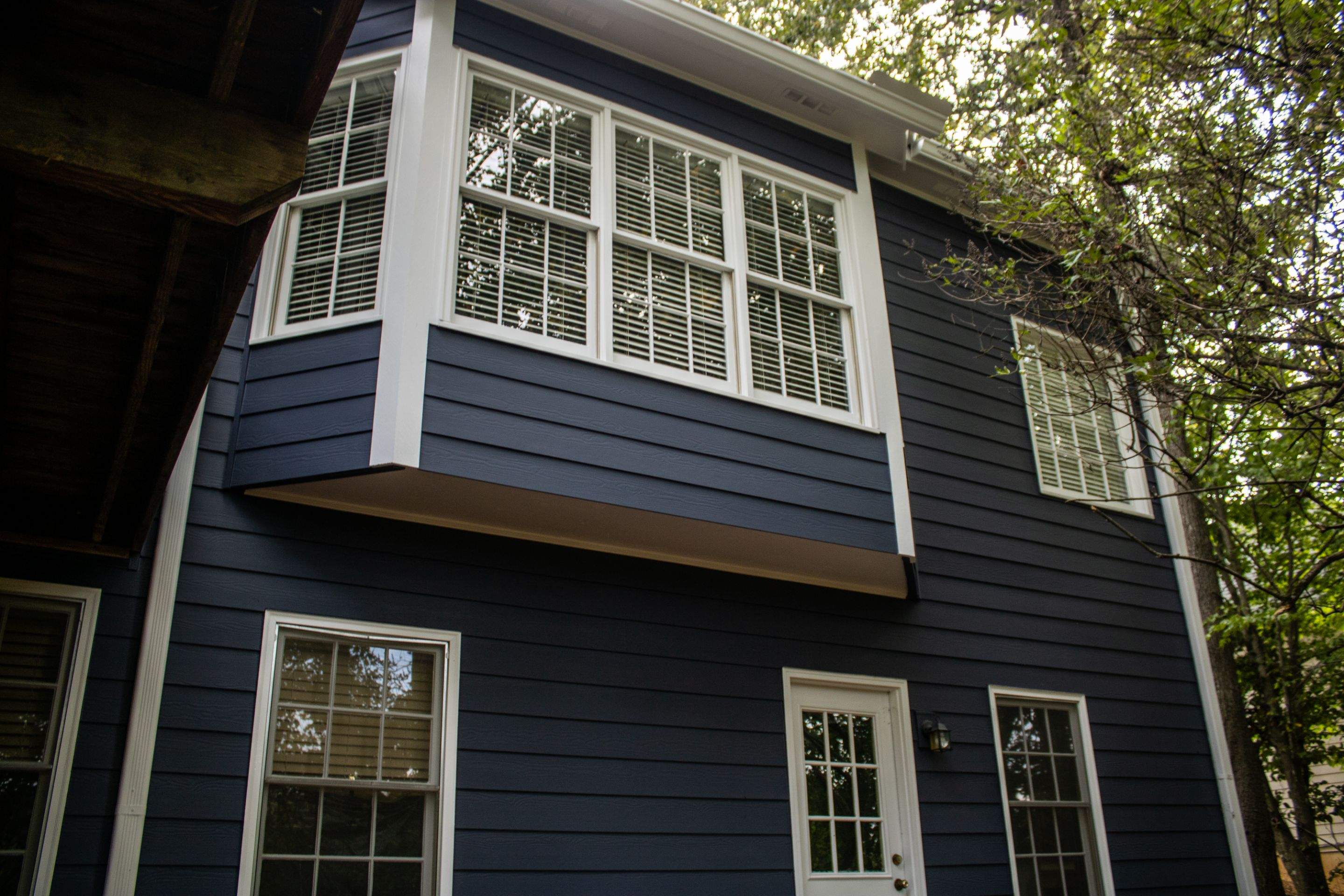 Blue Exterior Paint and Siding Installation using James Hardie Lap Siding by Nelson Exteriors