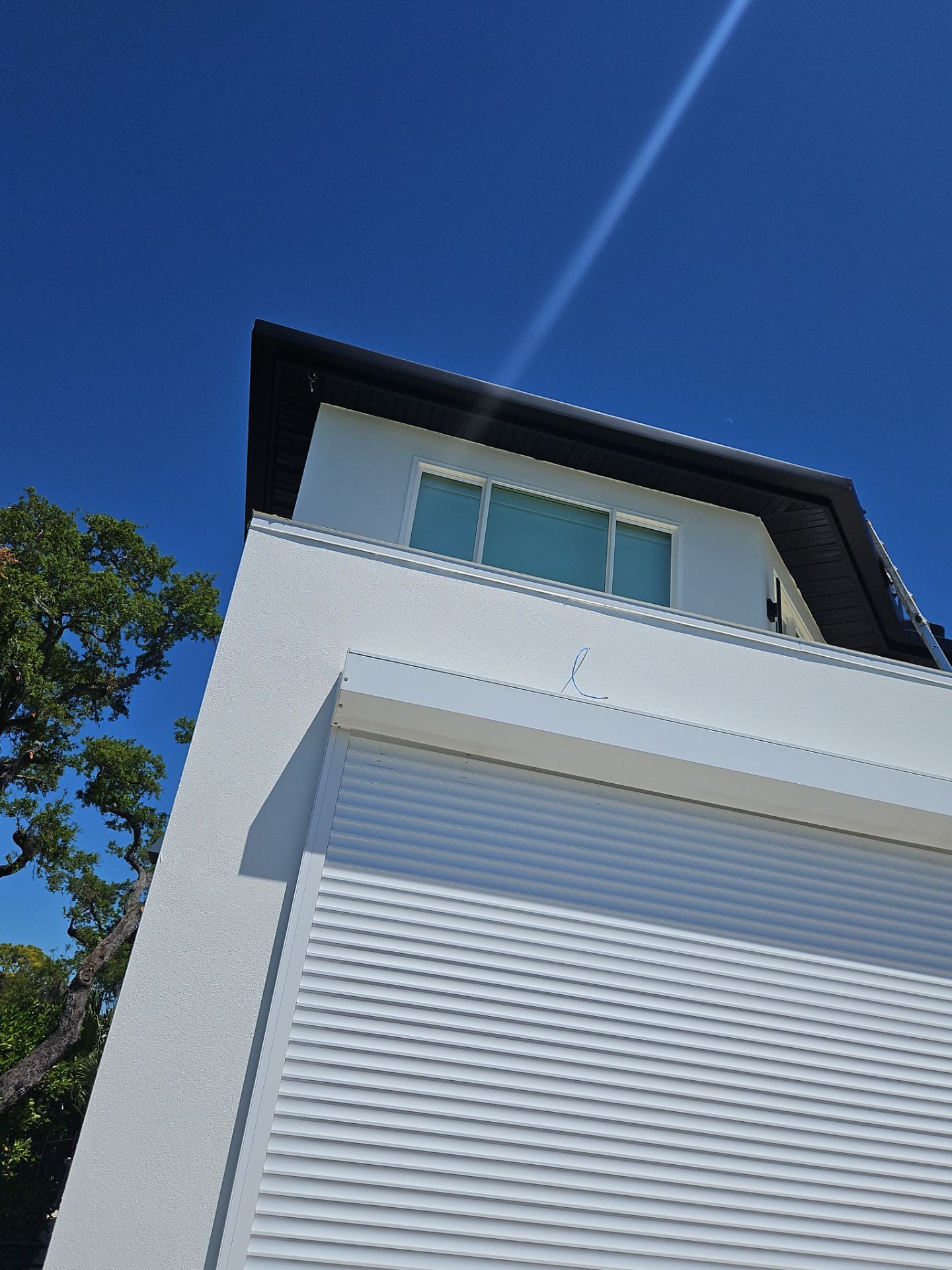 Soffit and Fascia Installation and black seamless gutters in Sarasota FL by Gutter Professors